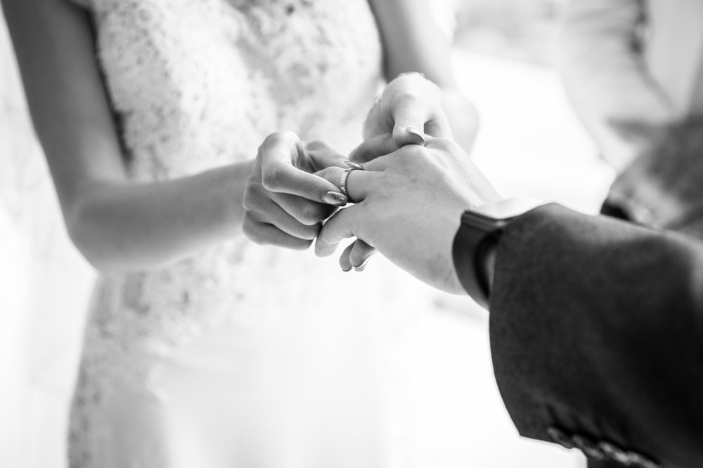A couple exchanging rings on their wedding day | Photo: Shutterstock.com