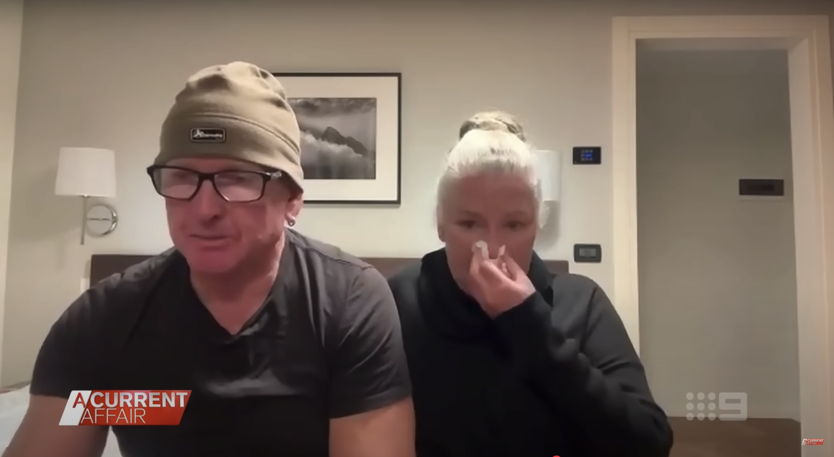 Mitchell Ring and his wife, Jennifer Colin, get emotional while sharing their experience mid-flight, as seen in a video dated February 24, 2025 | Source: YouTube/ACurrentAffair9