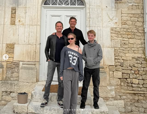 Neil Pattrick Harris and David Burtka posing for a picture with their twins Harper Grace and Gideon Scott Burtka-Harris, posted on June 21, 2024 | Source: Instagram/nph