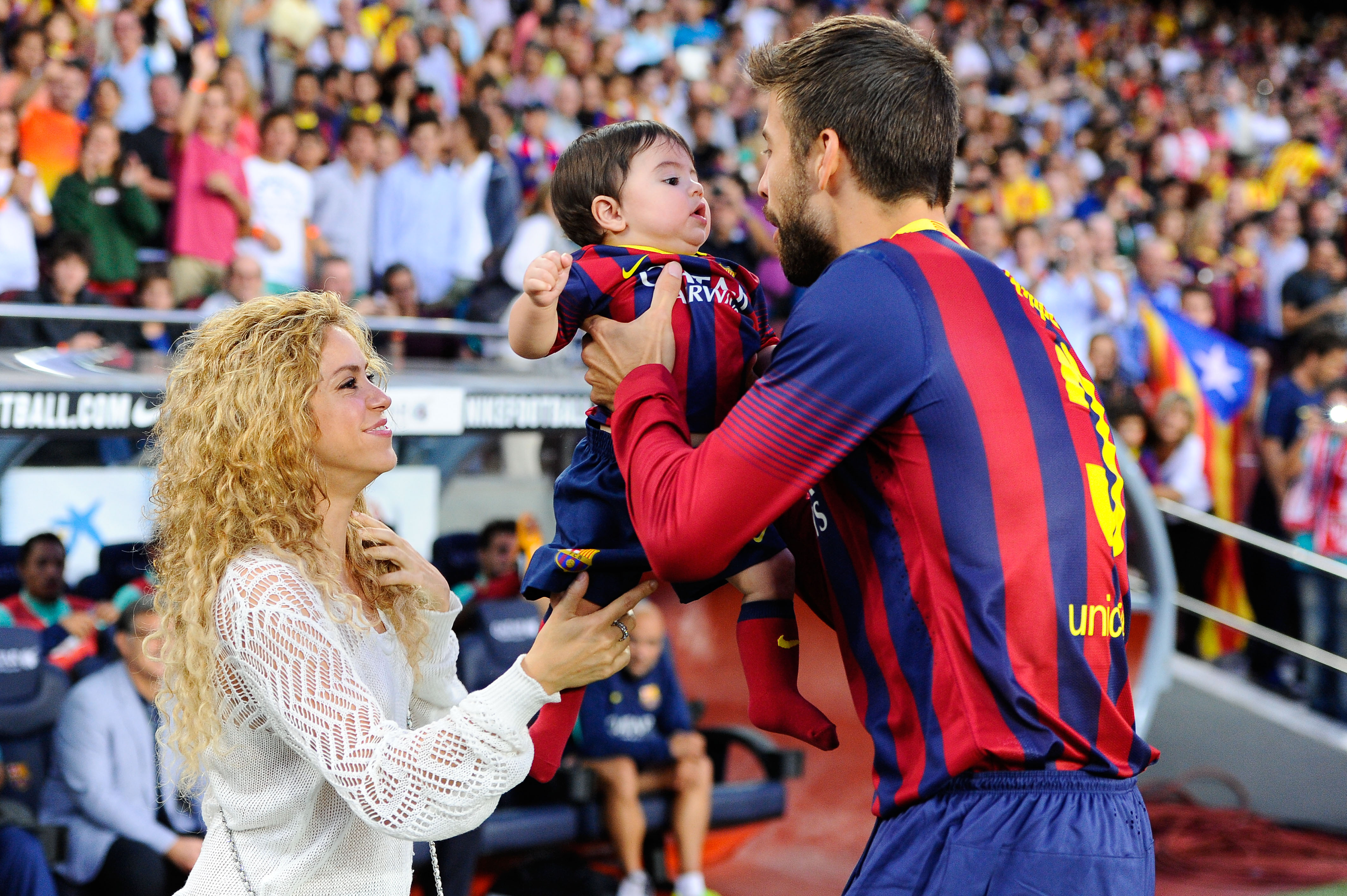 Shakira and Gerard Pique with their son, Milan, in September 2013 | Source: Getty Images