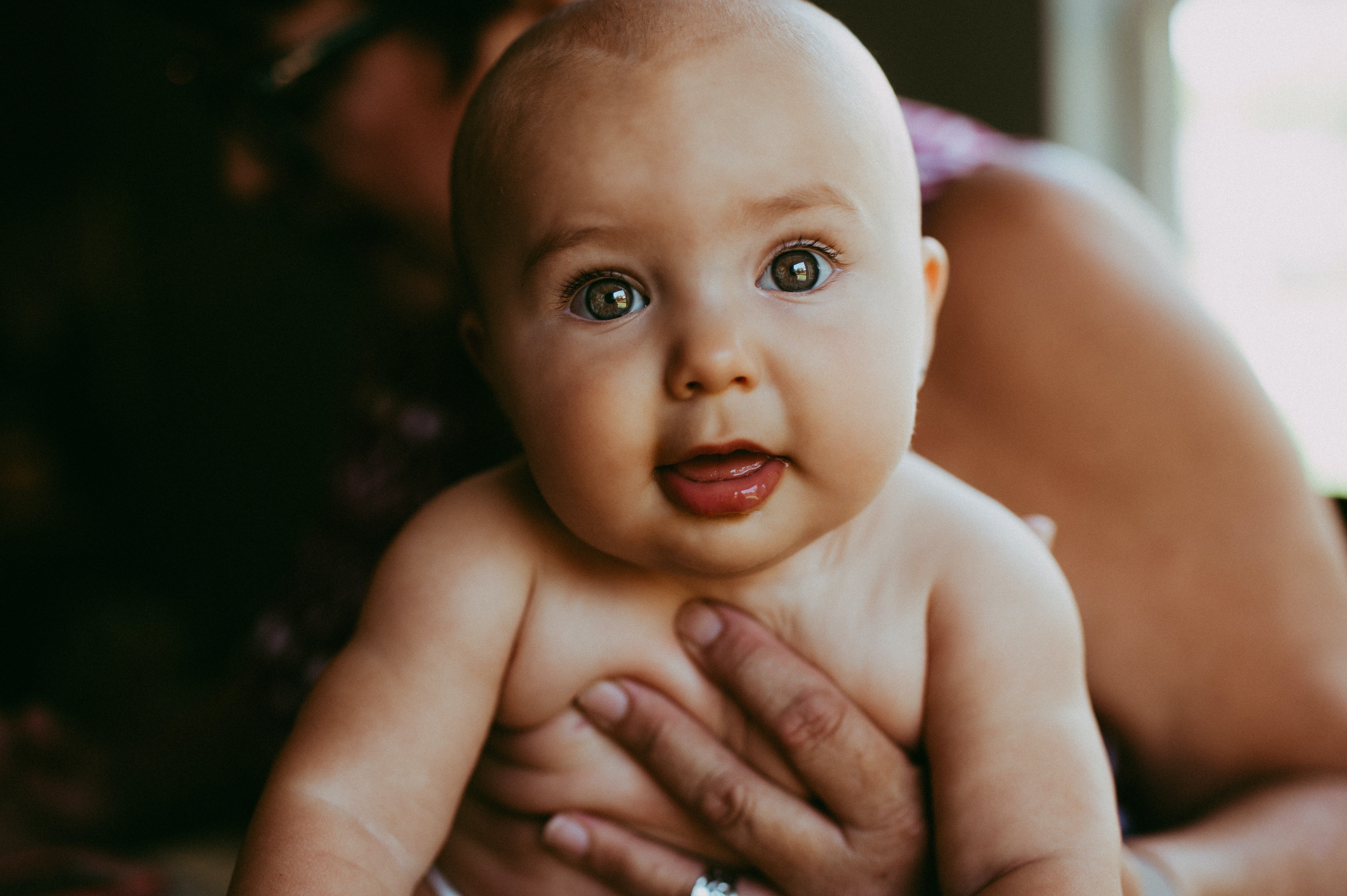 Older woman holding baby. | Source: Pexels