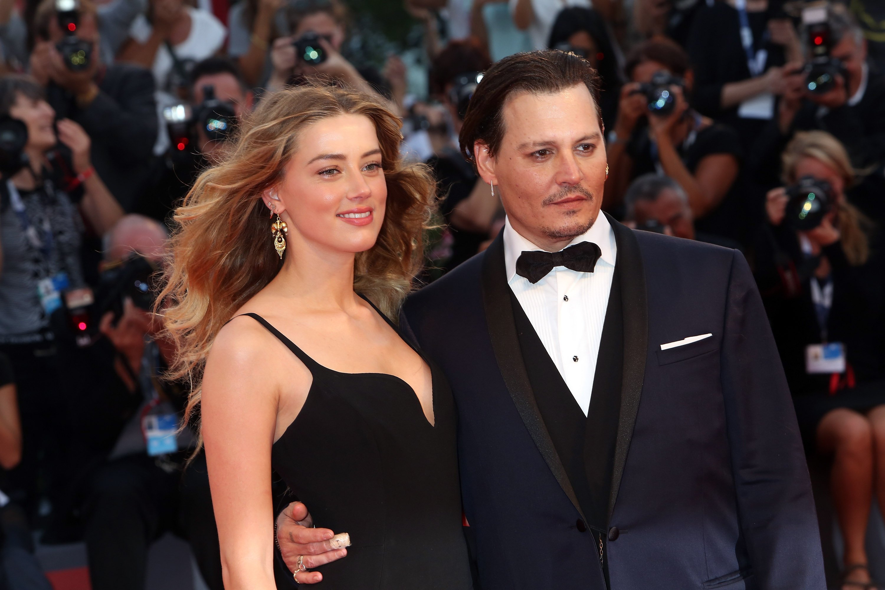 Johnny Depp and Amber Heard attend a premiere for 'Black Mass' during the 72nd Venice Film Festival on September 4, 2015 in Venice, Italy. | Source: Getty Images