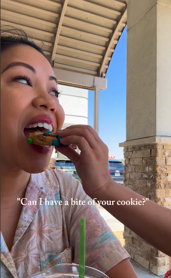 Maya feeding her mom, Thy Mitchell, a cookie. | Source: Instagram/thy_travelers