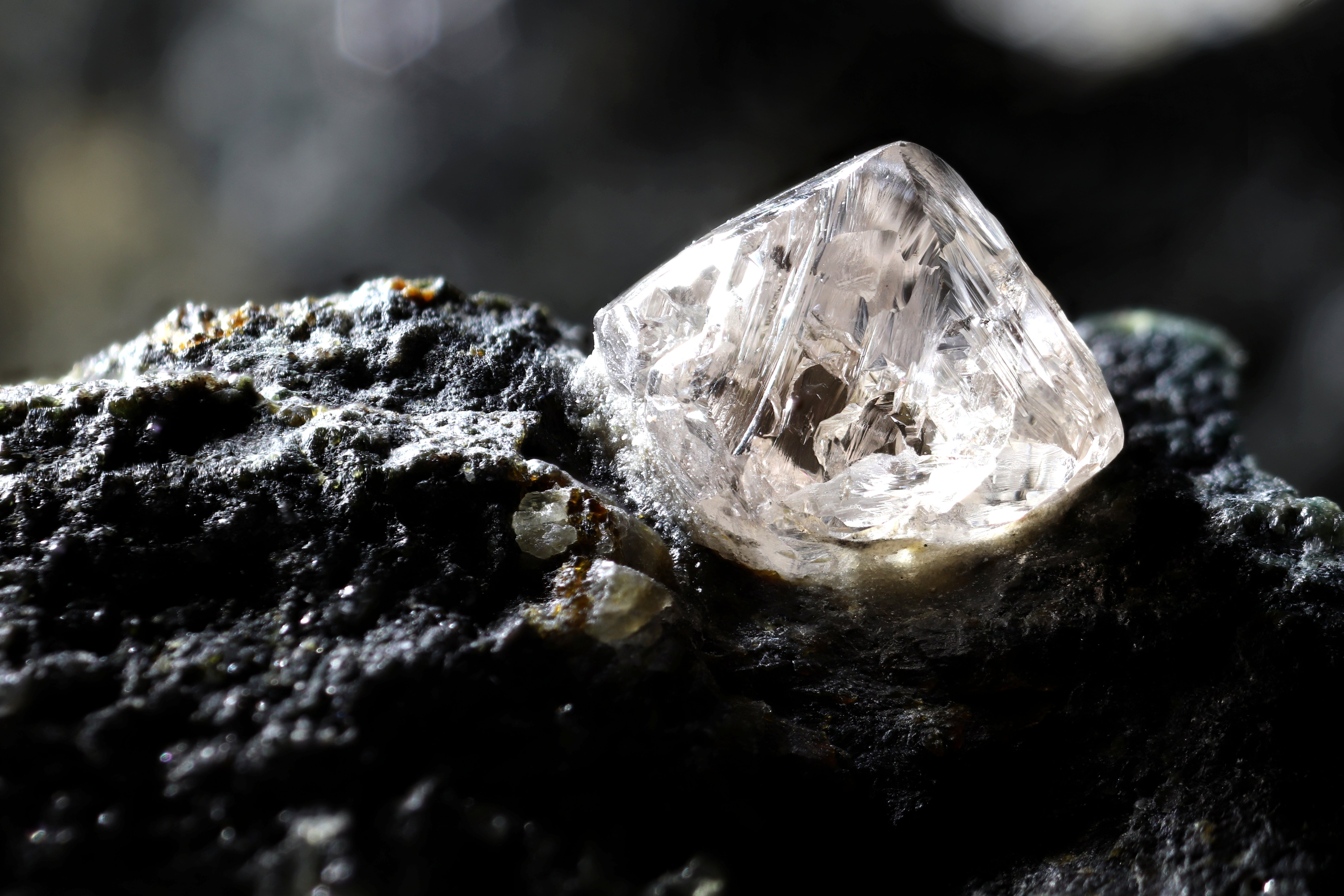 A natural diamond nestled in kimberlite | Source: Shutterstock