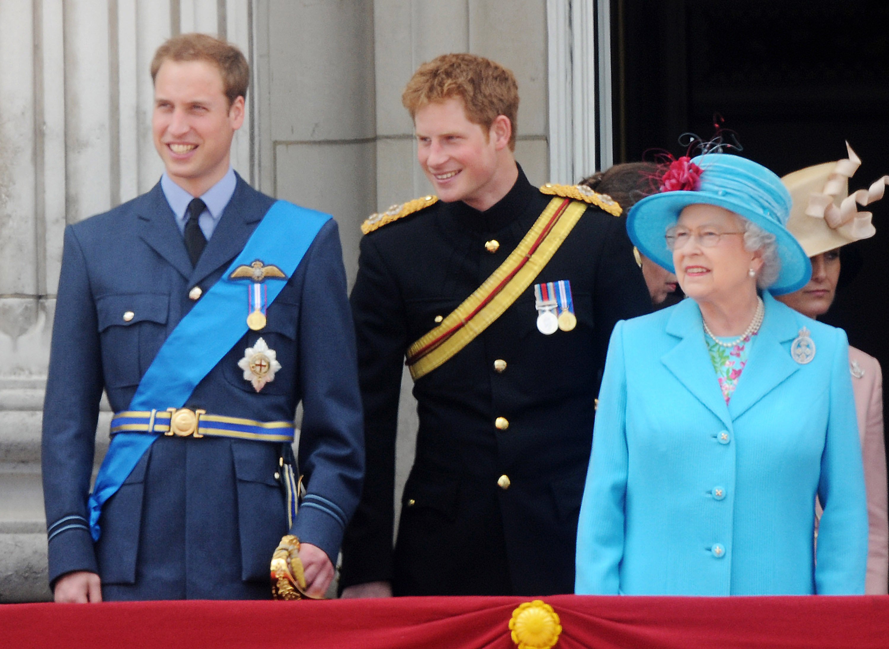 Prince William, Prince Harry and Queen Elizabeth II watching a fly past from the balcony of Buckingham Palace during Trooping The Colour on June 13, 2008 in London, England. │Source: Getty Images