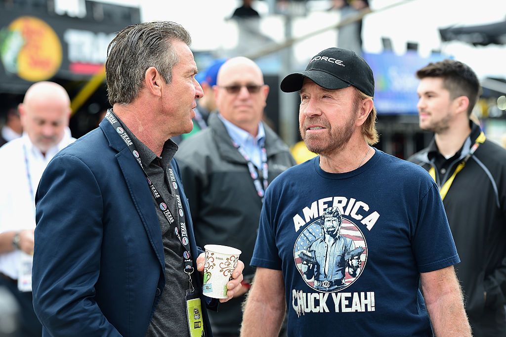 Dennis Quaid and Chuck Norris look on prior to the NASCAR Sprint Cup Series AAA Texas 500 at Texas Motor Speedway on November 6, 2016 in Fort Worth, Texas. | Source: Getty Images