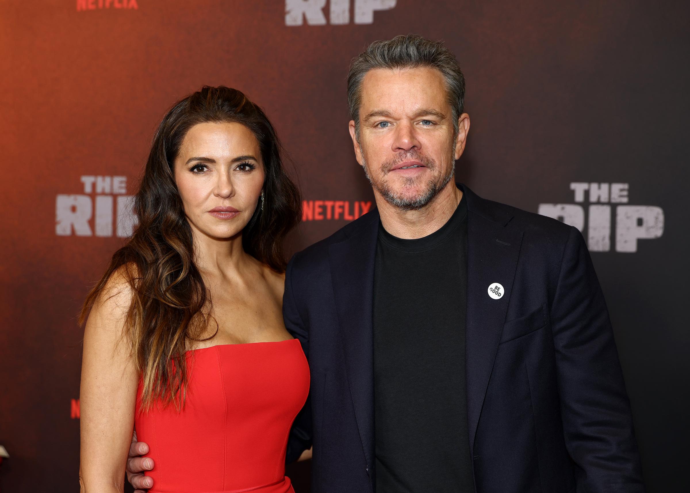 In a coordinated show of style, Matt Damon and Luciana Barroso pose confidently before entering the venue for the film's screening.