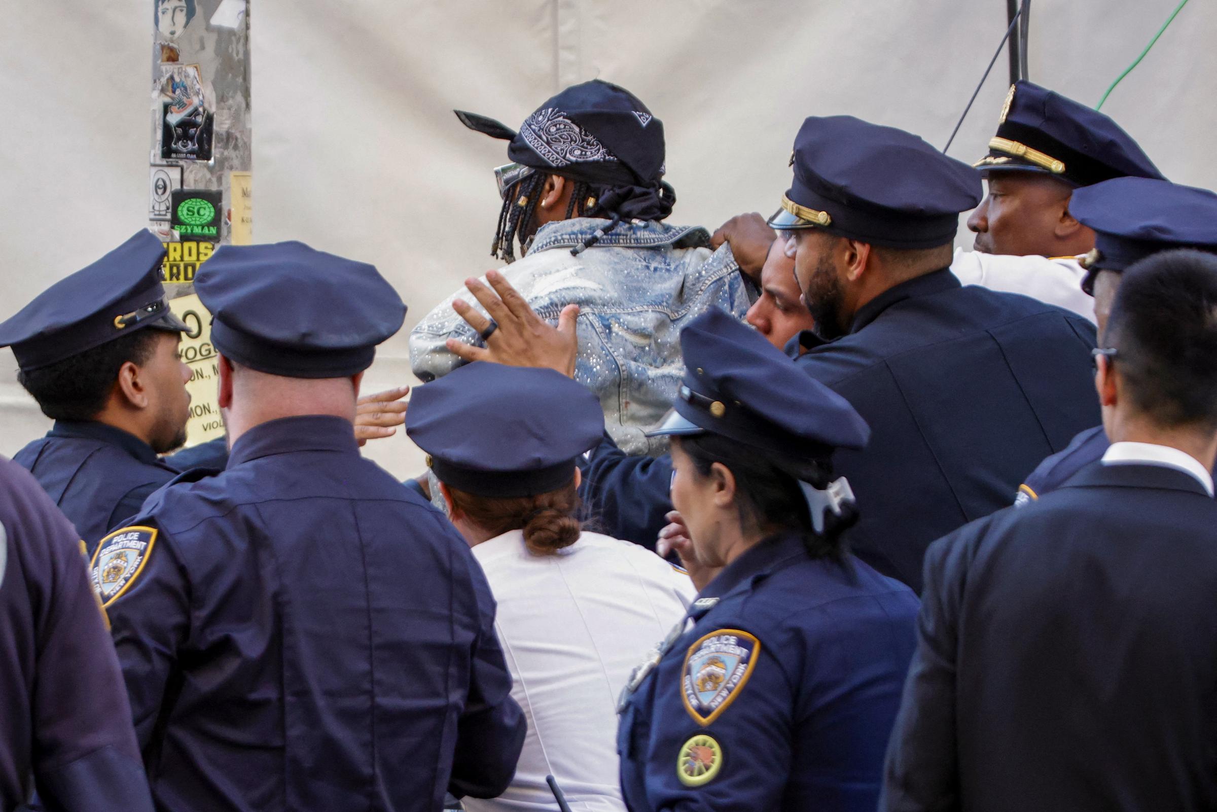 A man is detained by NYPD officers after he tried to break into the red carpet of the 2026 Met Gala | Source: Getty Images