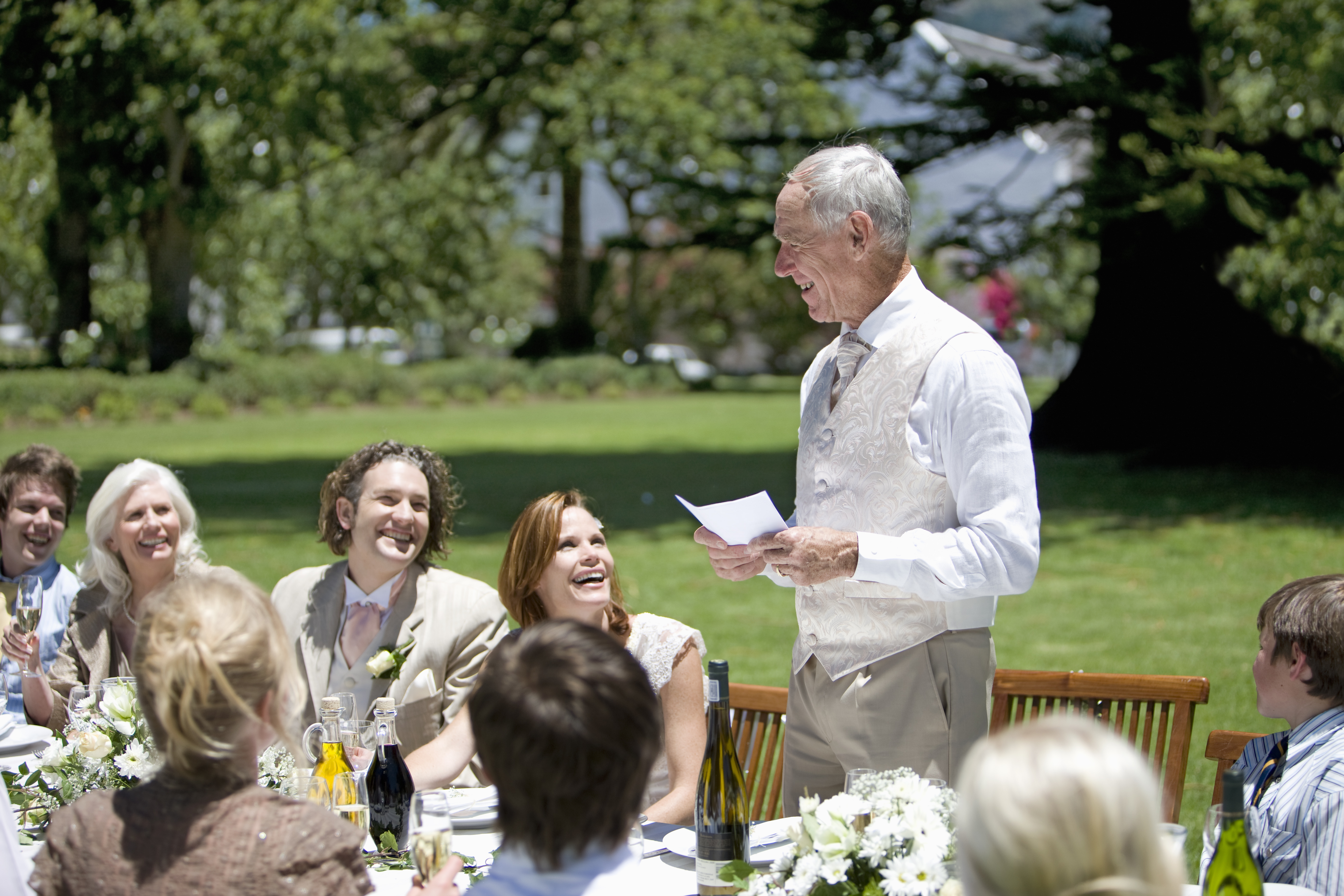 A man speaking at a wedding | Source: Shutterstock