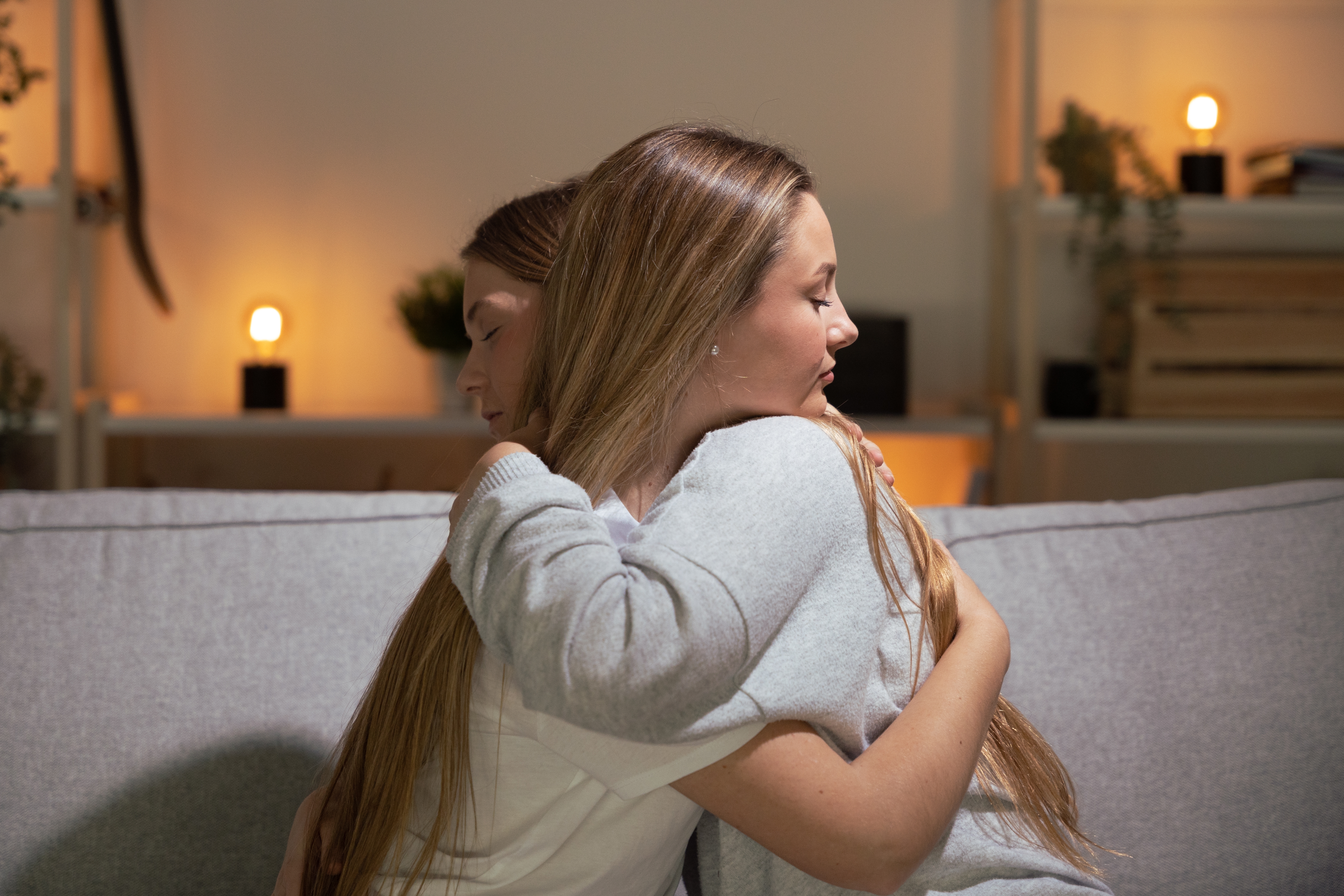 A young woman is pictured comforting another sad woman | Source: Shutterstock