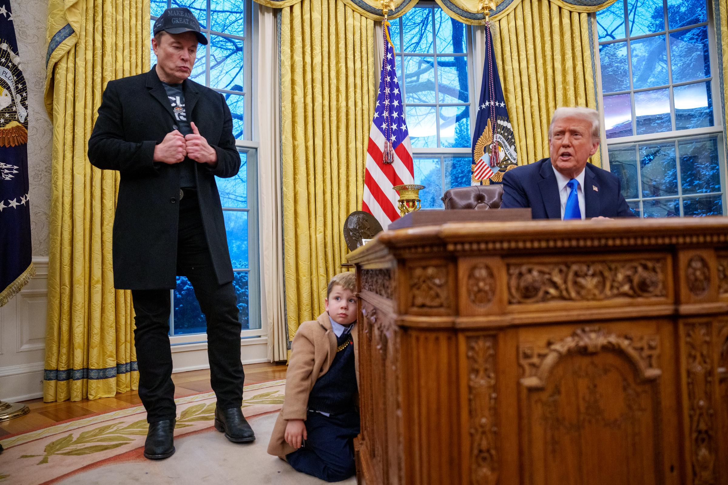 President Donald Trump, accompanied by Elon Musk and X Æ A-Xii, speaks during an executive order signing in the Oval Office, on February 11, 2025 | Source: Getty Images