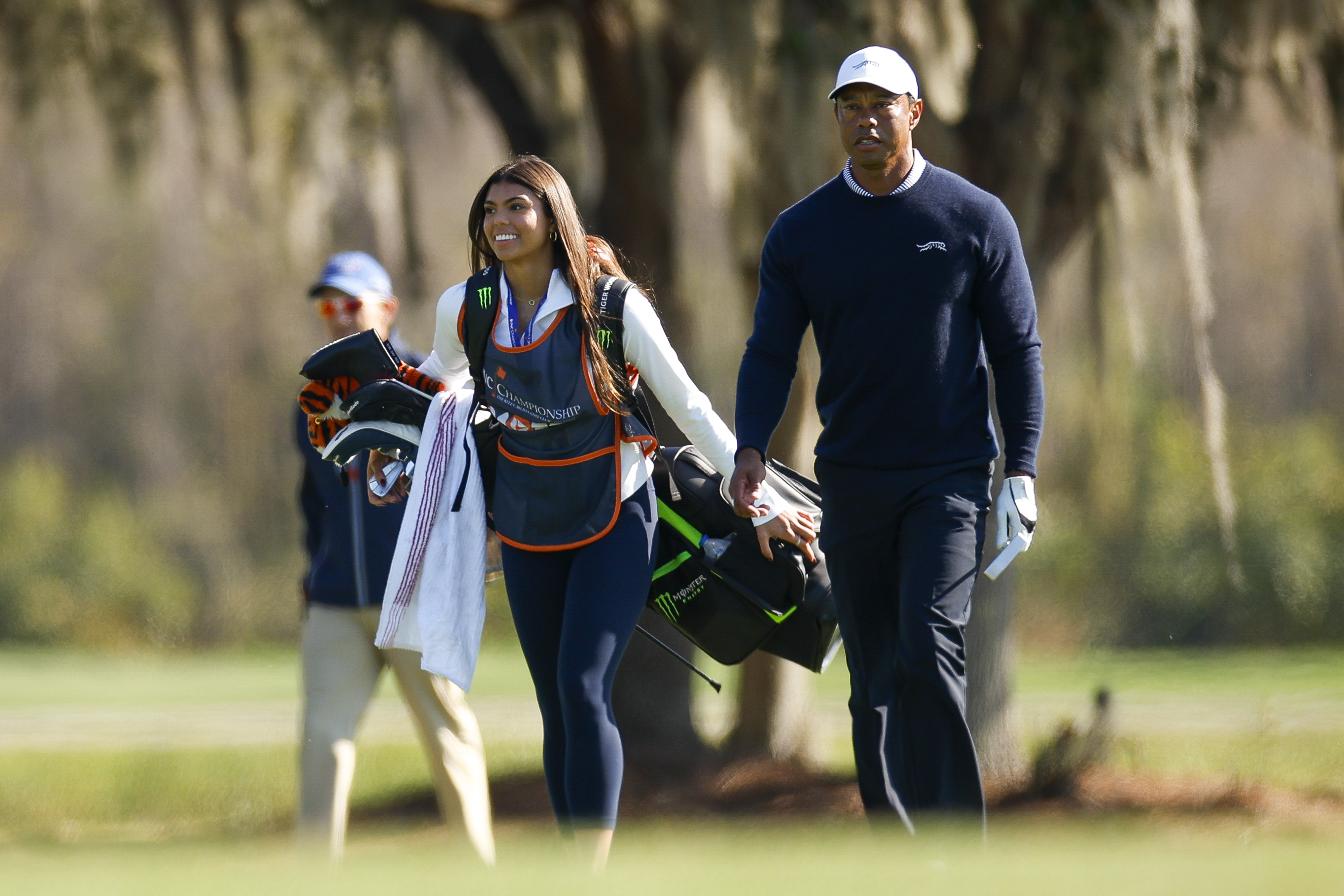 Sam and Tiger Woods walk the 11th hole during the first round of the PNC Championship at Ritz-Carlton Golf Club in Orlando, Florida, on December 21, 2024 | Source: Getty Images