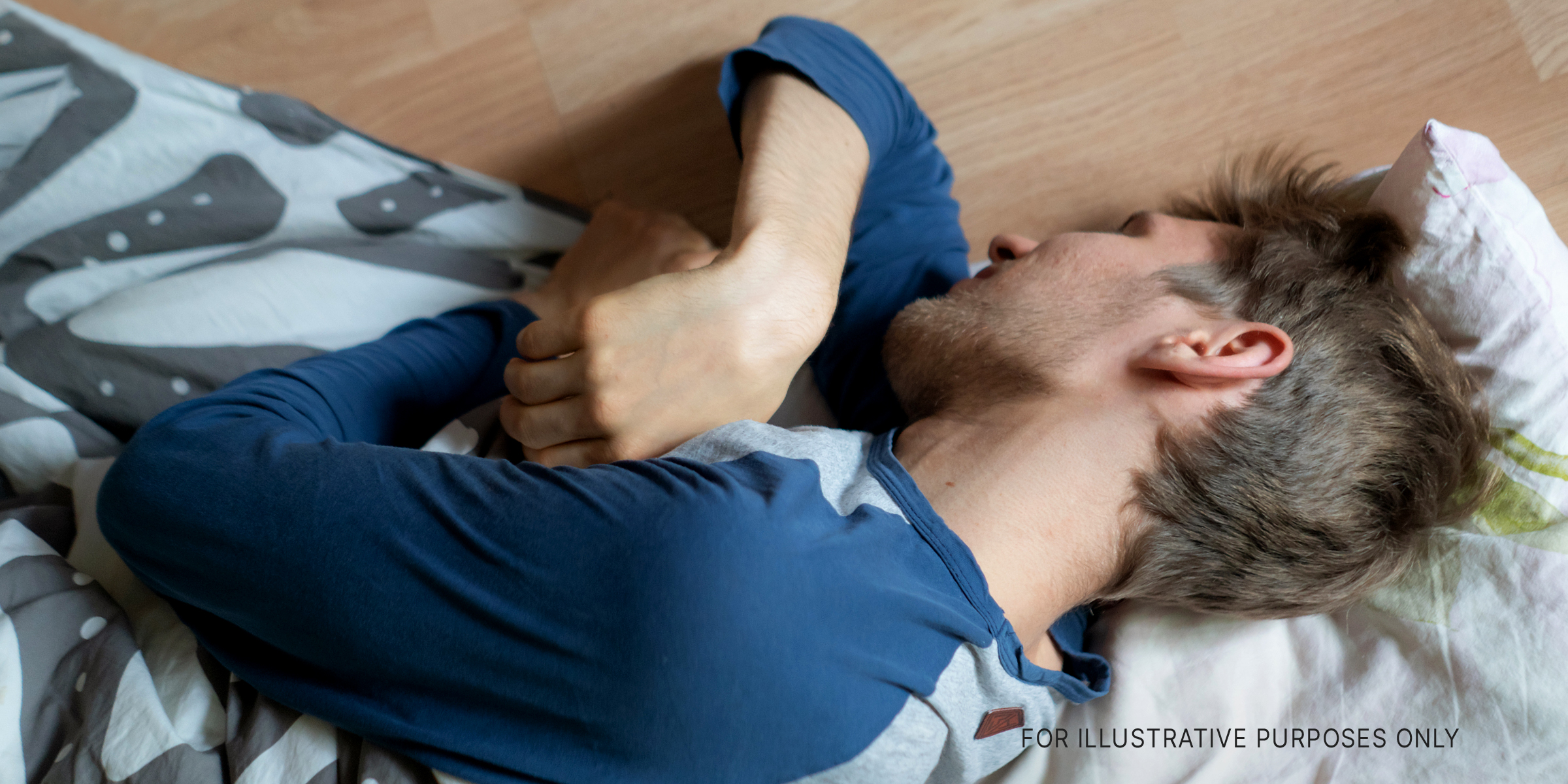 A man sleeping on the floor | Source: Shutterstock