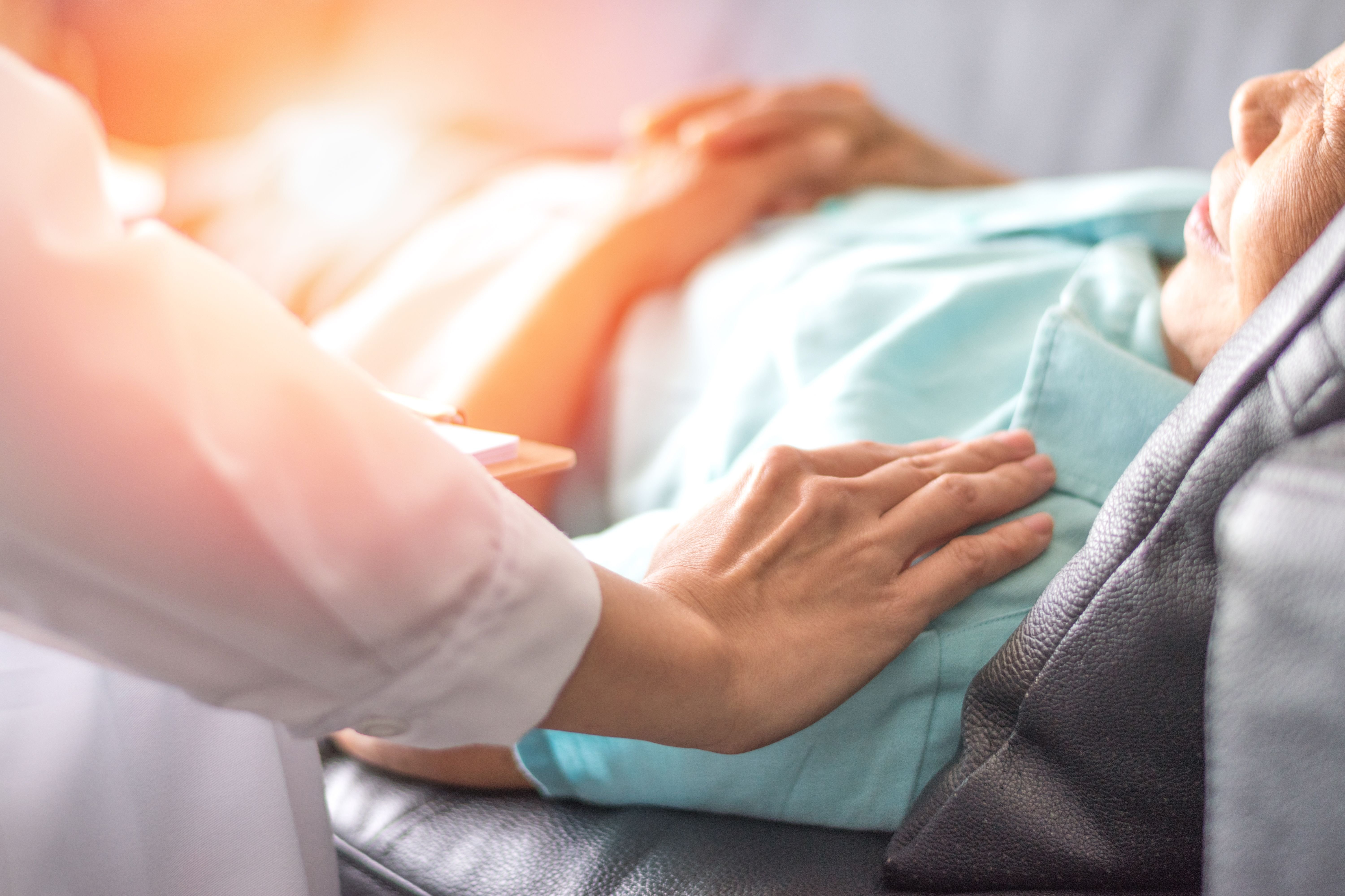 A doctor holding the patient's bed in a hospital. | Source: Shutterstock