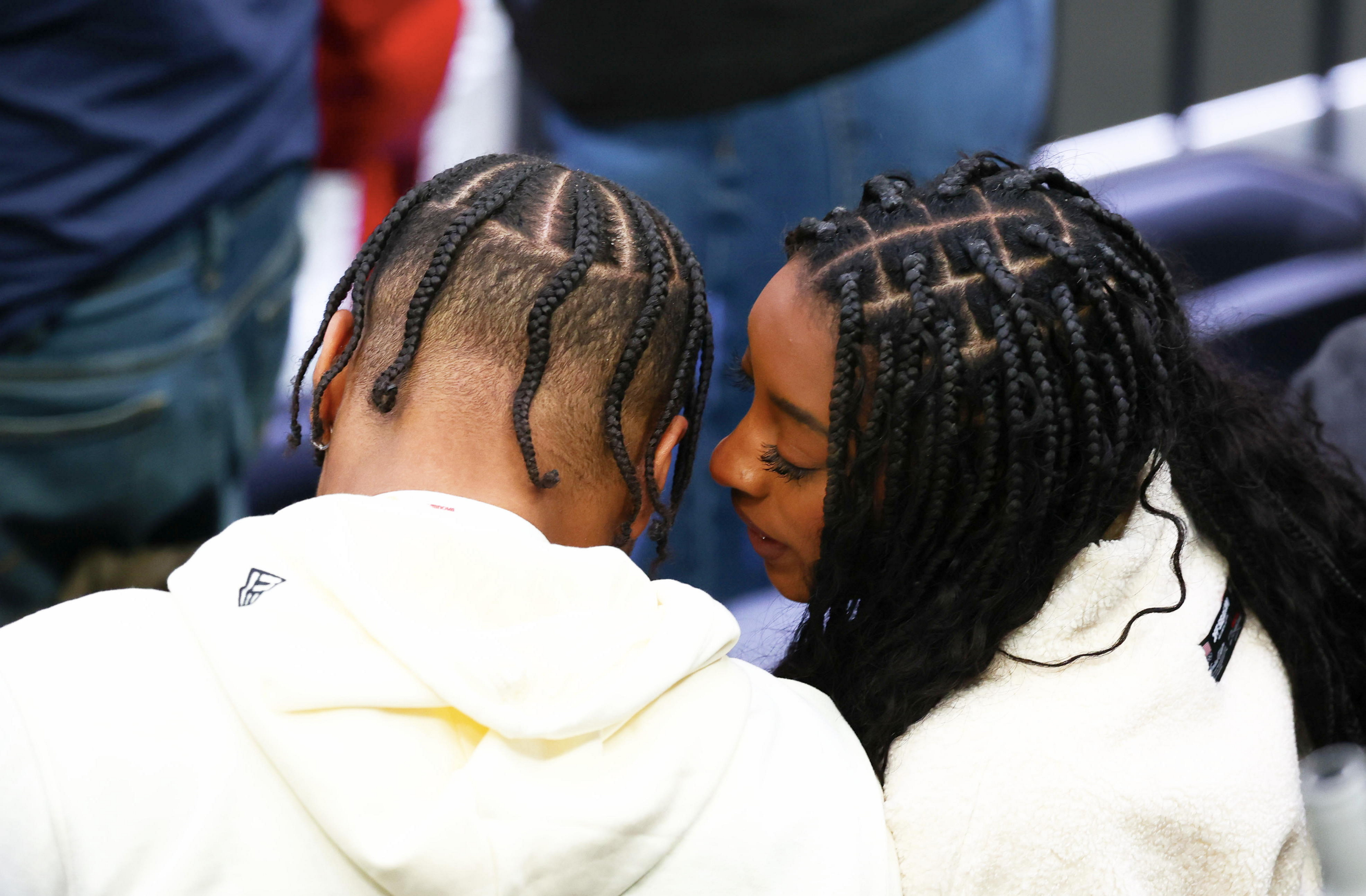 Not every public appearance by the couple takes place on a red carpet. While attending a men's ice hockey playoff quarterfinal at the Milano Cortina 2026 Winter Olympics, they were photographed sharing a moment in the stands. | Source: Getty Images