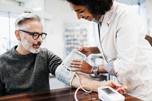 A patient checking his blood pressure with a specialist equipment | Photo: Getty Images