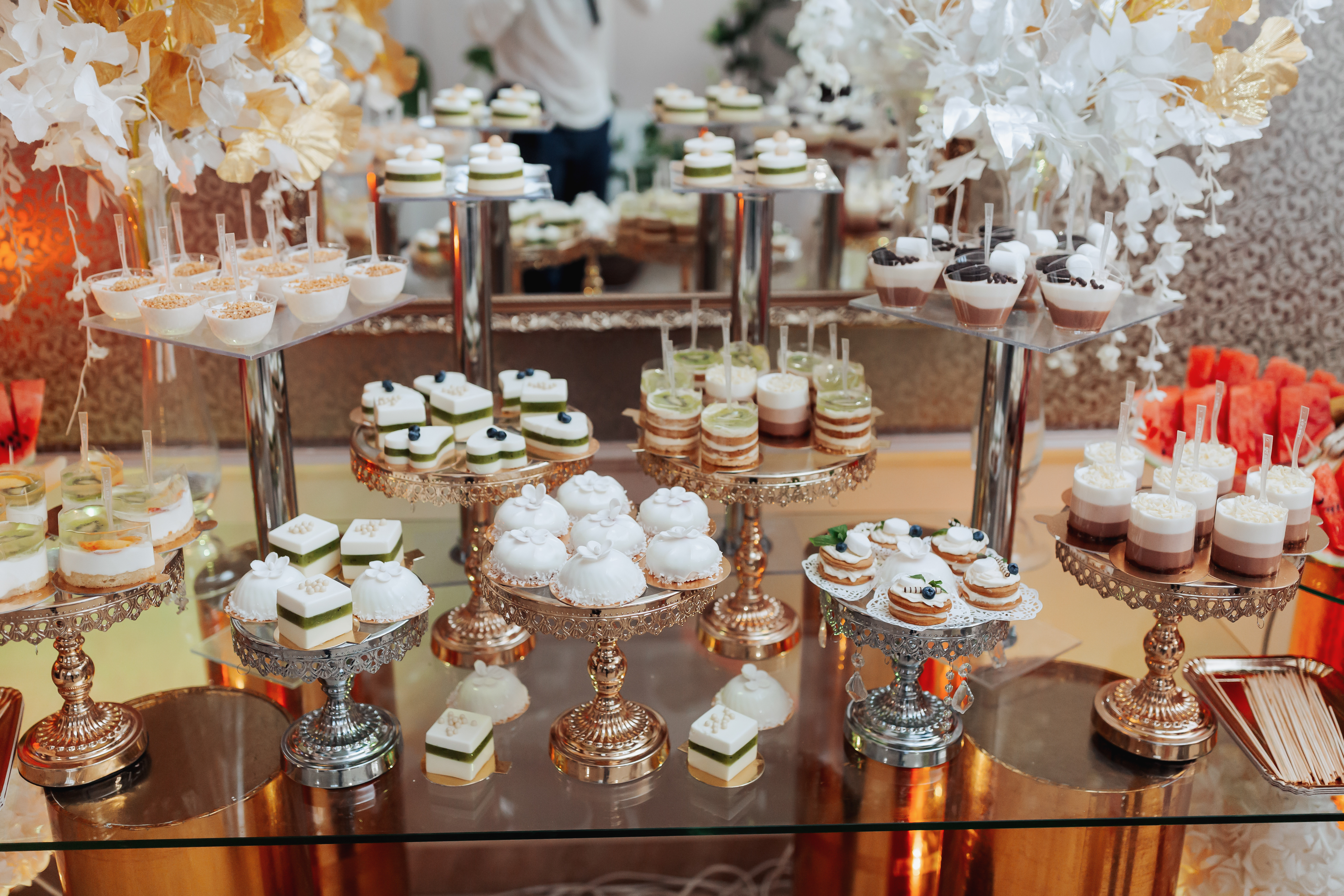 A delicious wedding. Candy bar for a banquet. Celebration concept. Fashionable desserts. Table with sweets, candies. Fruits | Source: Getty Images