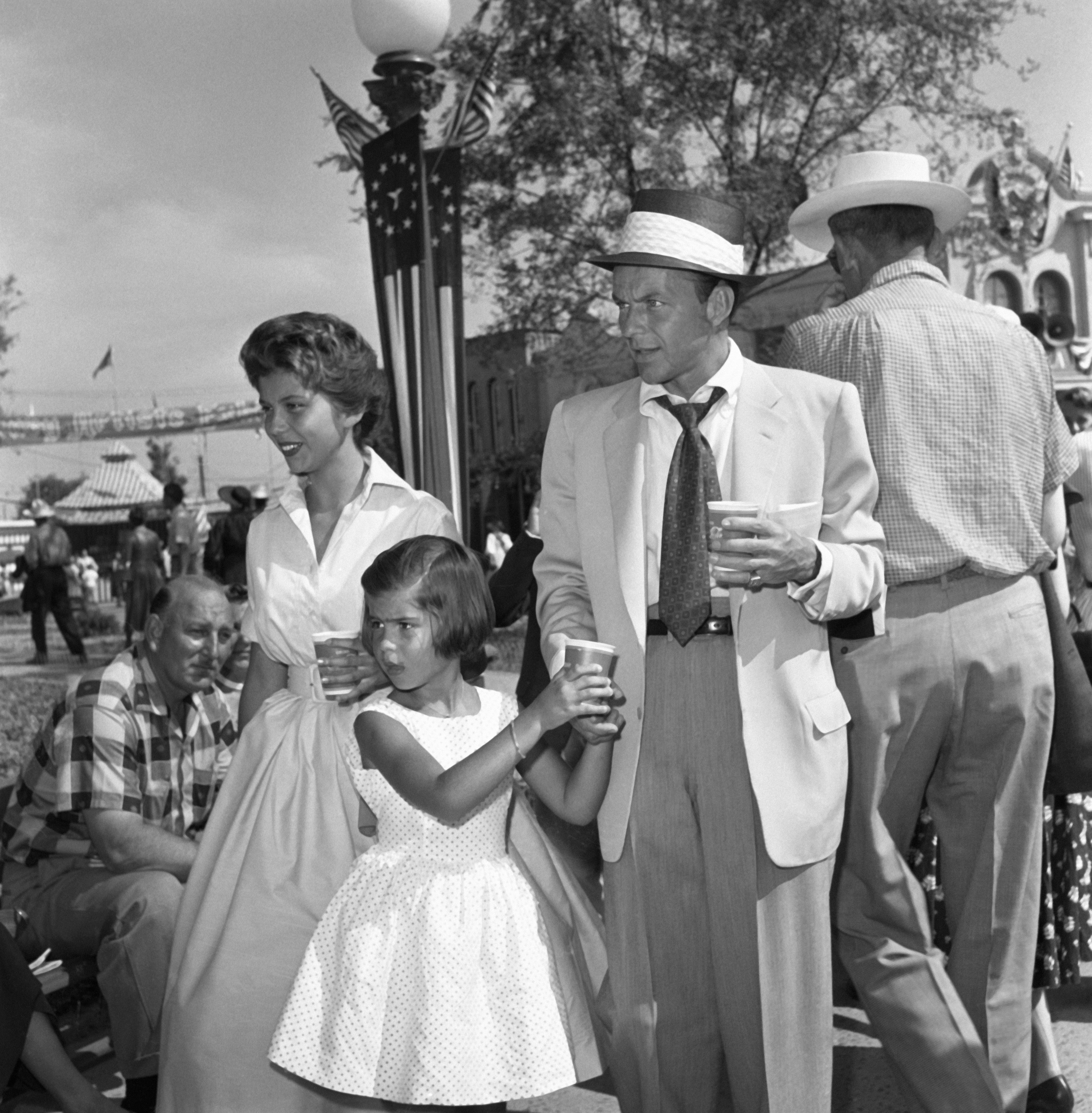 Frank Sinatra with his daughters Nancy and Tina, circa 1956 | Source: Getty Images