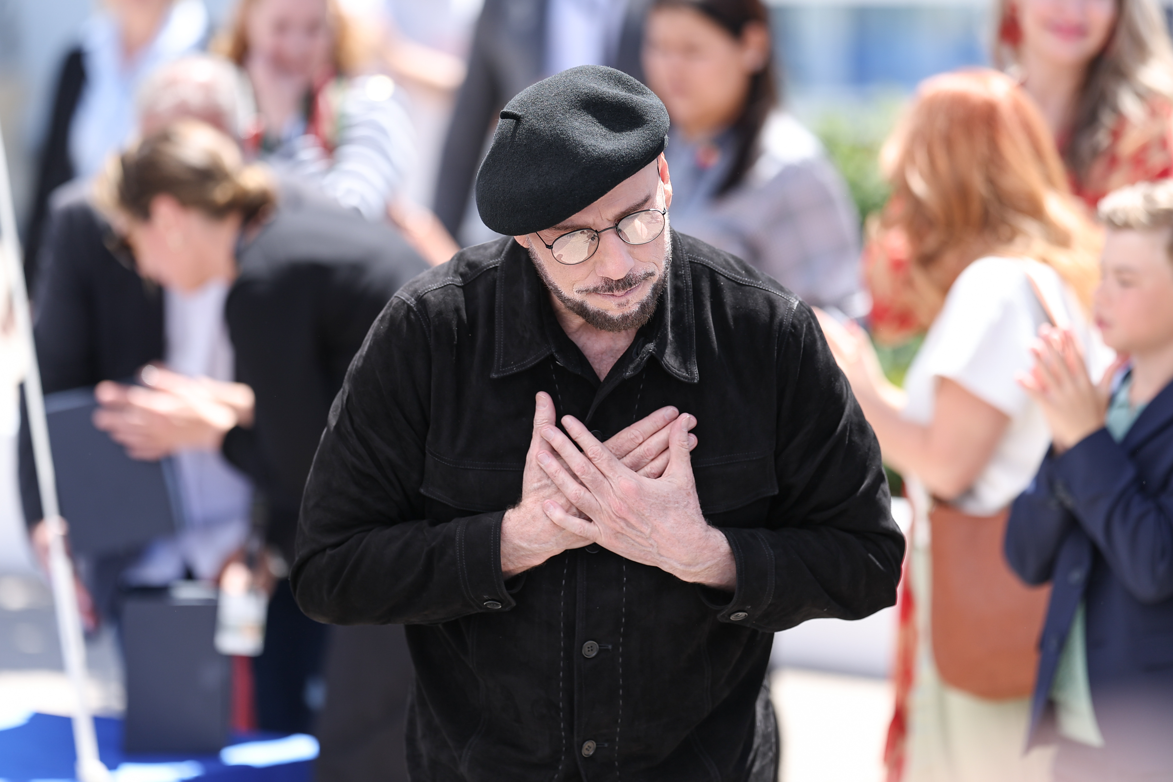 John Travolta poses during the "Propeller One-Way Night Coach" photocall at the annual Cannes Film Festival at Palais des Festivals on May 16, 2026, in Cannes, France | Source: Getty Images