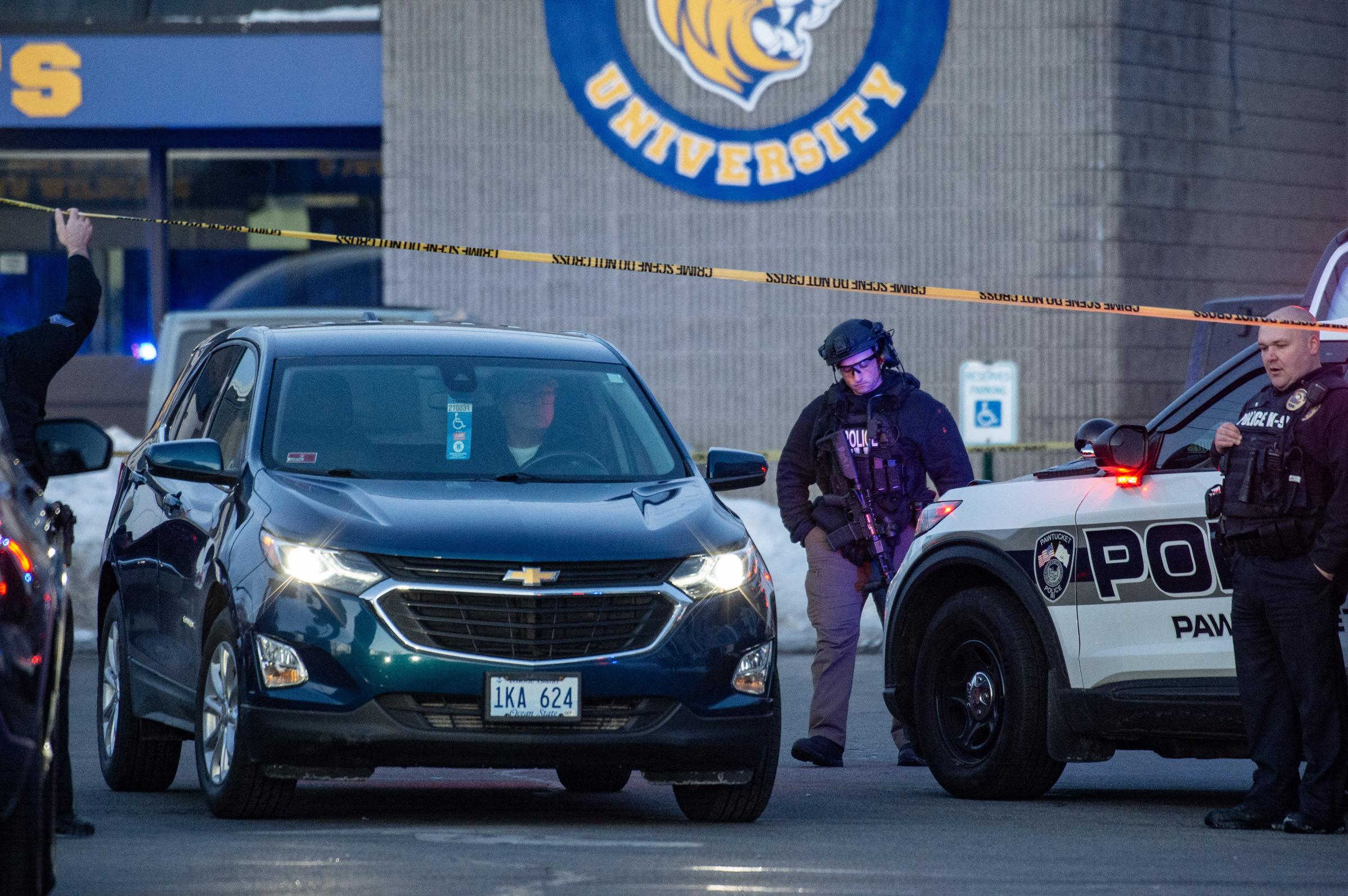 Police stand outside the perimeter they created around the Dennis M. Lynch Arena where a shooting occurred in Pawtucket, Rhode Island, on February 16, 2026. | Source: Getty Images