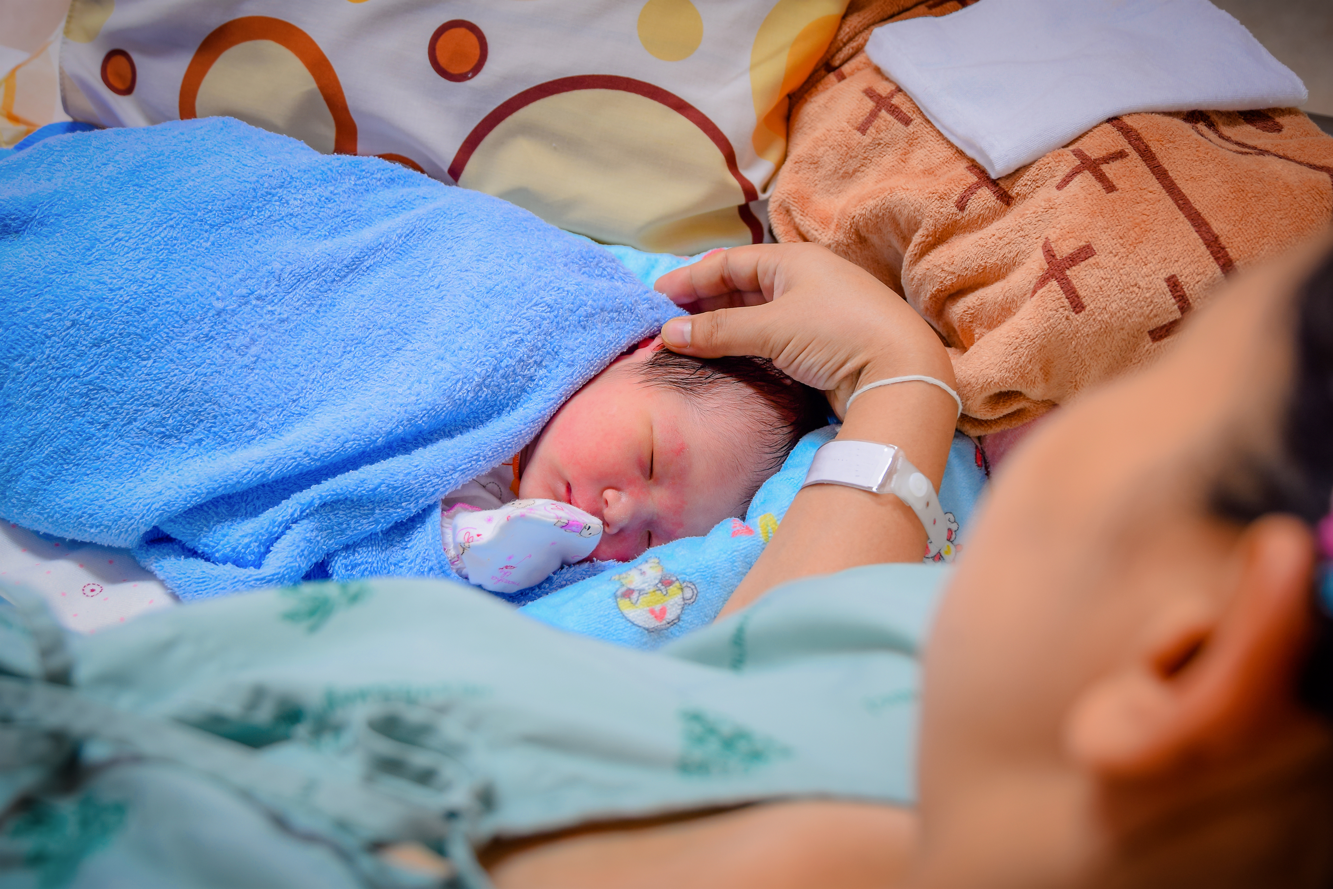 A woman with her newborn baby | Source: Shutterstock