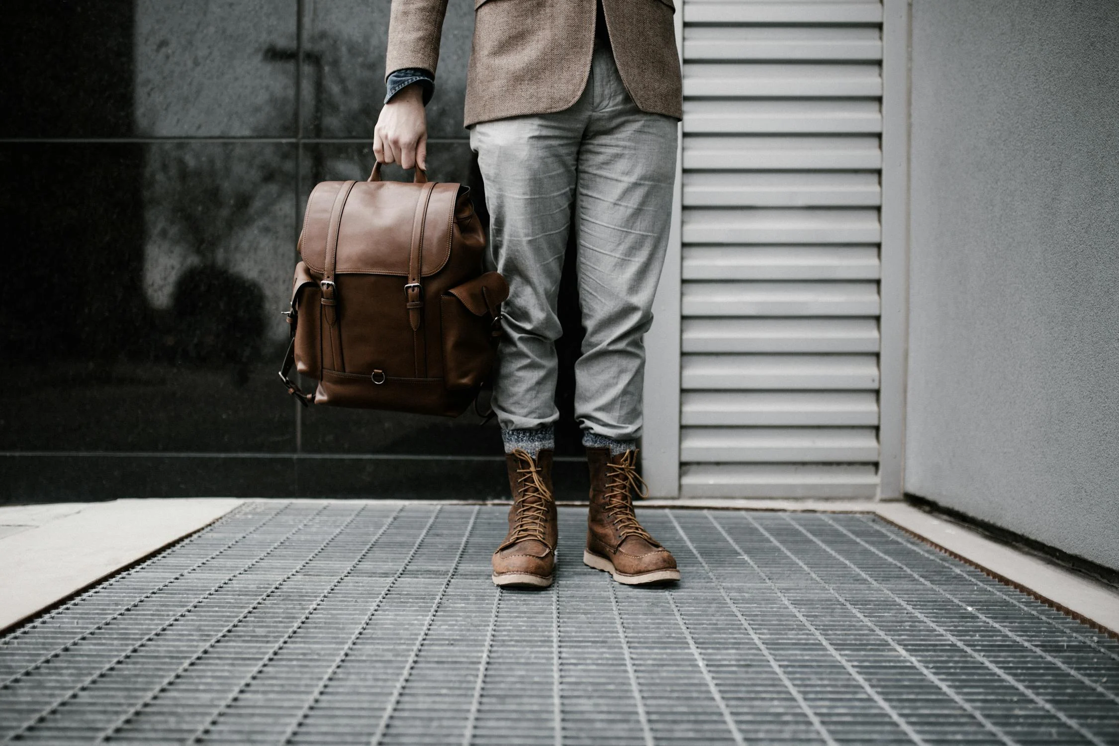 A man standing with his bag | Source: Pexels