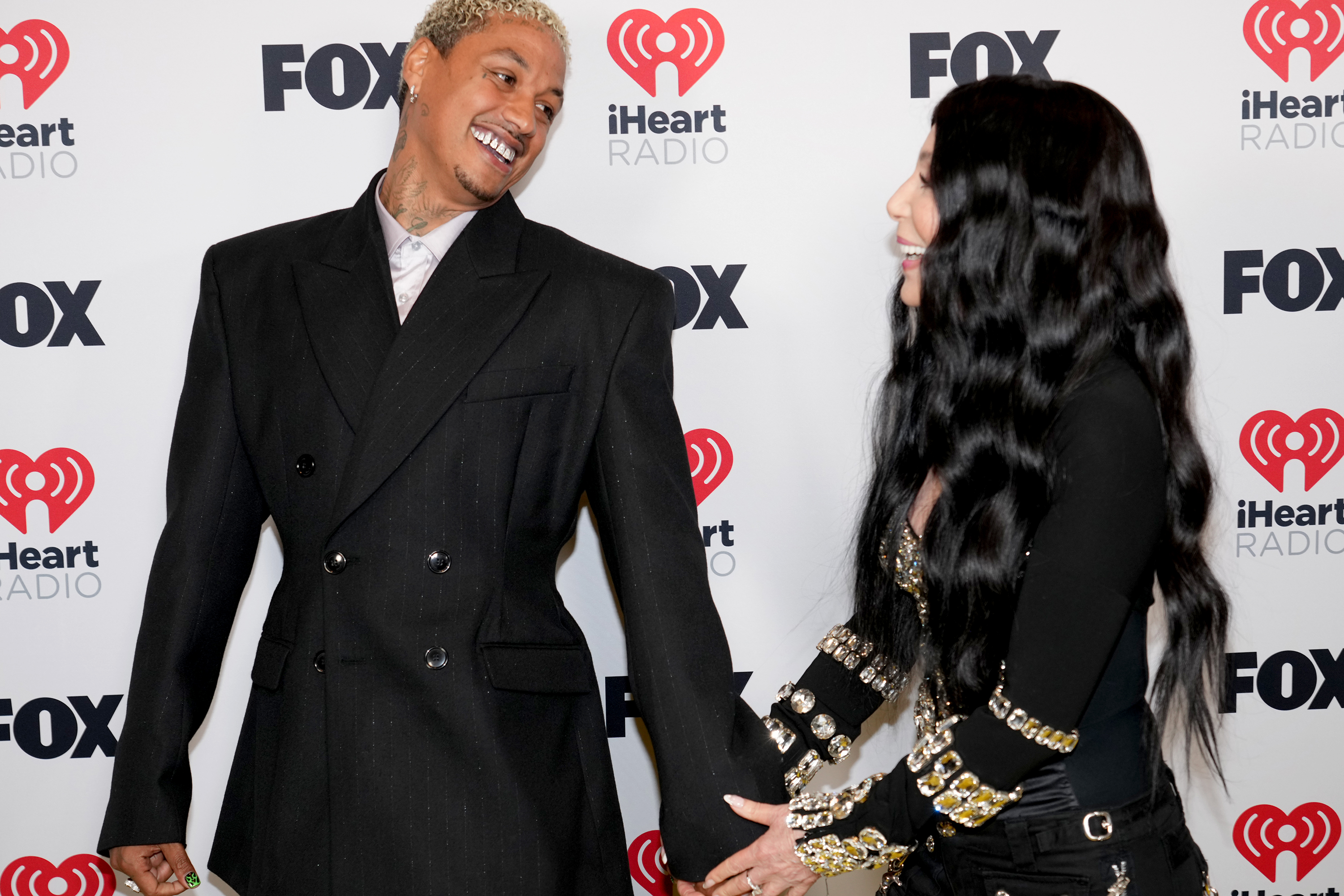Alexander 'AE' Edwards and Cher during the 2024 iHeartRadio Music Awards at Dolby Theatre on April 01, 2024 in Hollywood, California | Source: Getty Images