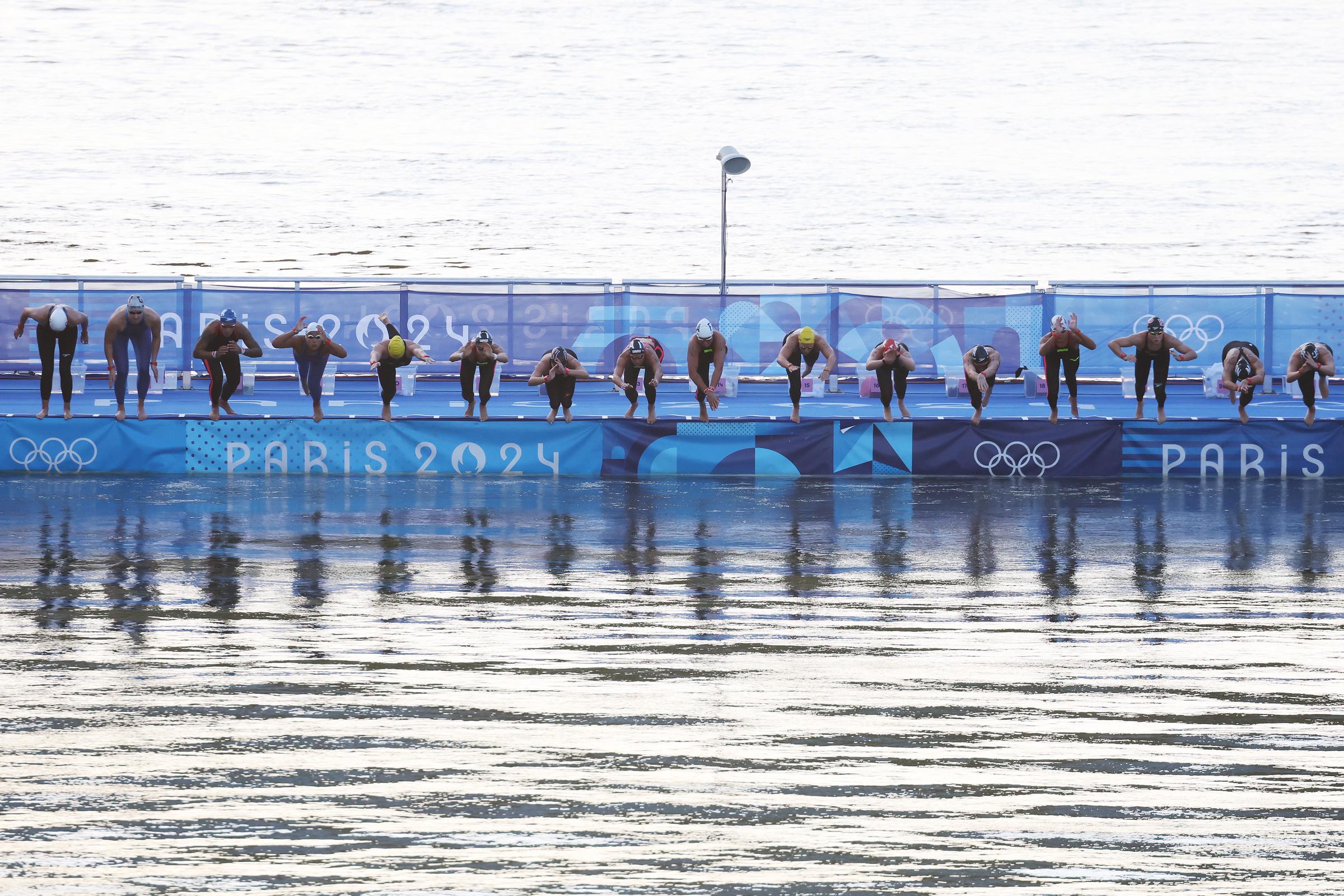 A general view as athletes dive into the River Seine to compete in the Marathon Swimming Women's 10k at the Olympic Games in Paris, France, on August 8, 2024 | Source: Getty Images