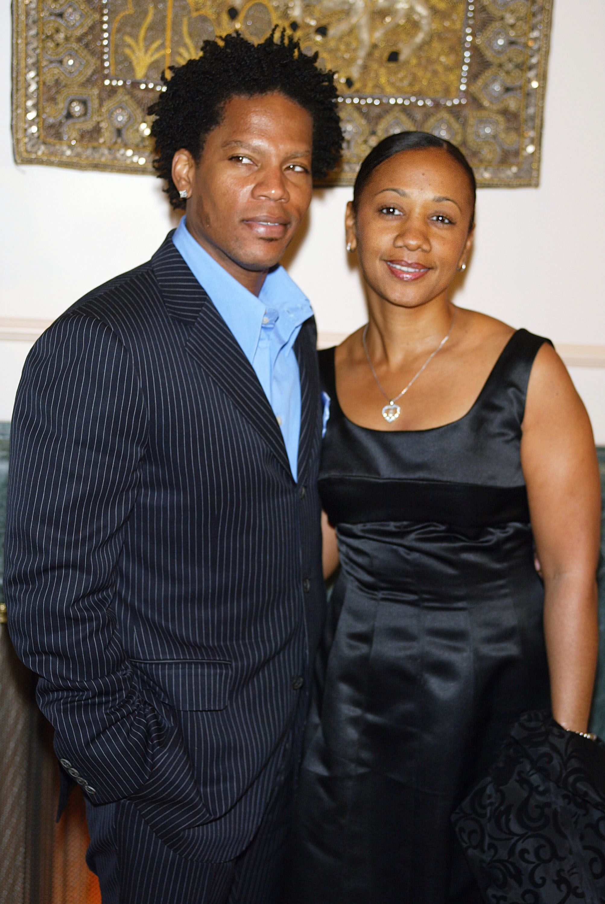  D.L. Hughley and his wife LaDonna pose at "Night of the Butterfly", hosted by Chrysalis, at a private residence on March 20, 2003 in Los Angeles | Source: Getty Images 