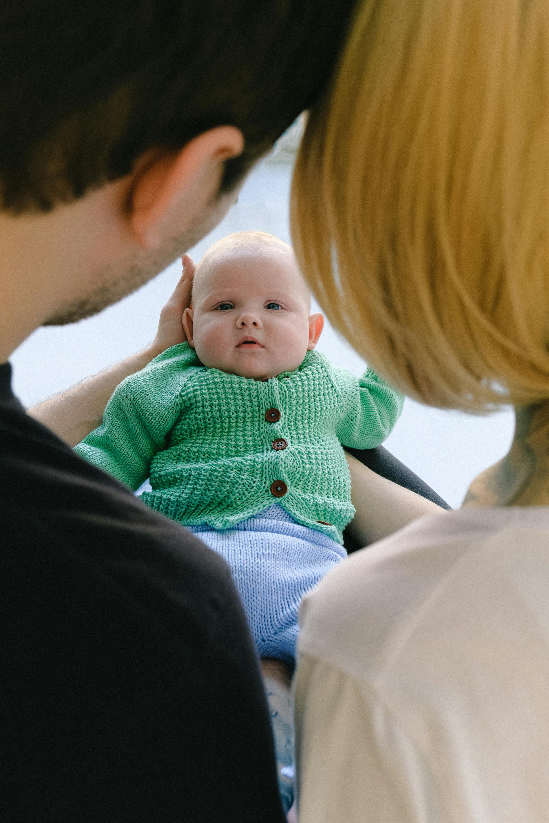 A couple looking at their child | Source: Pexels