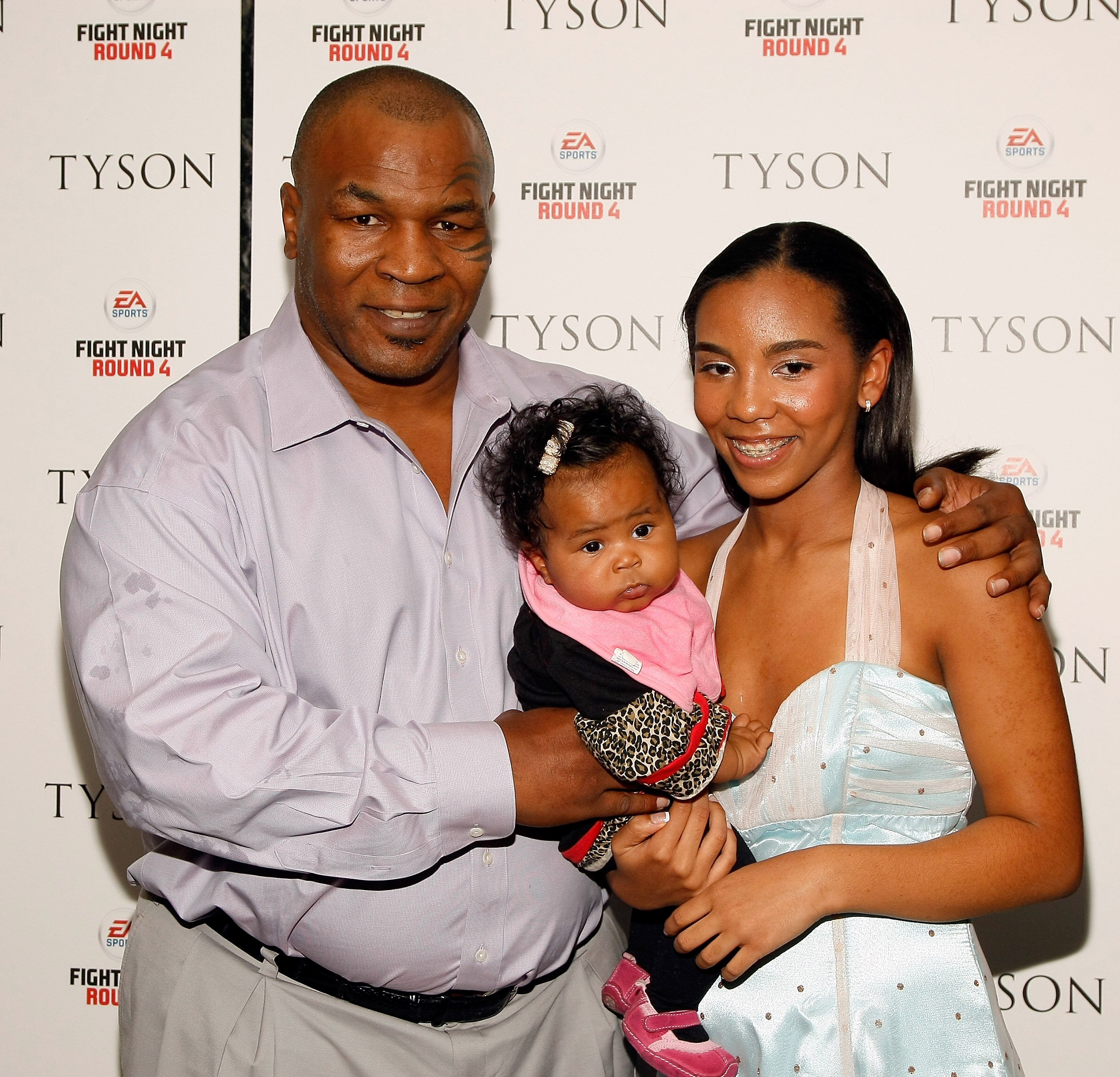 Former Heavy Weight Champion Boxer Mike Tyson, Ramsey (right) and his youngest daughter attend a screening of 
