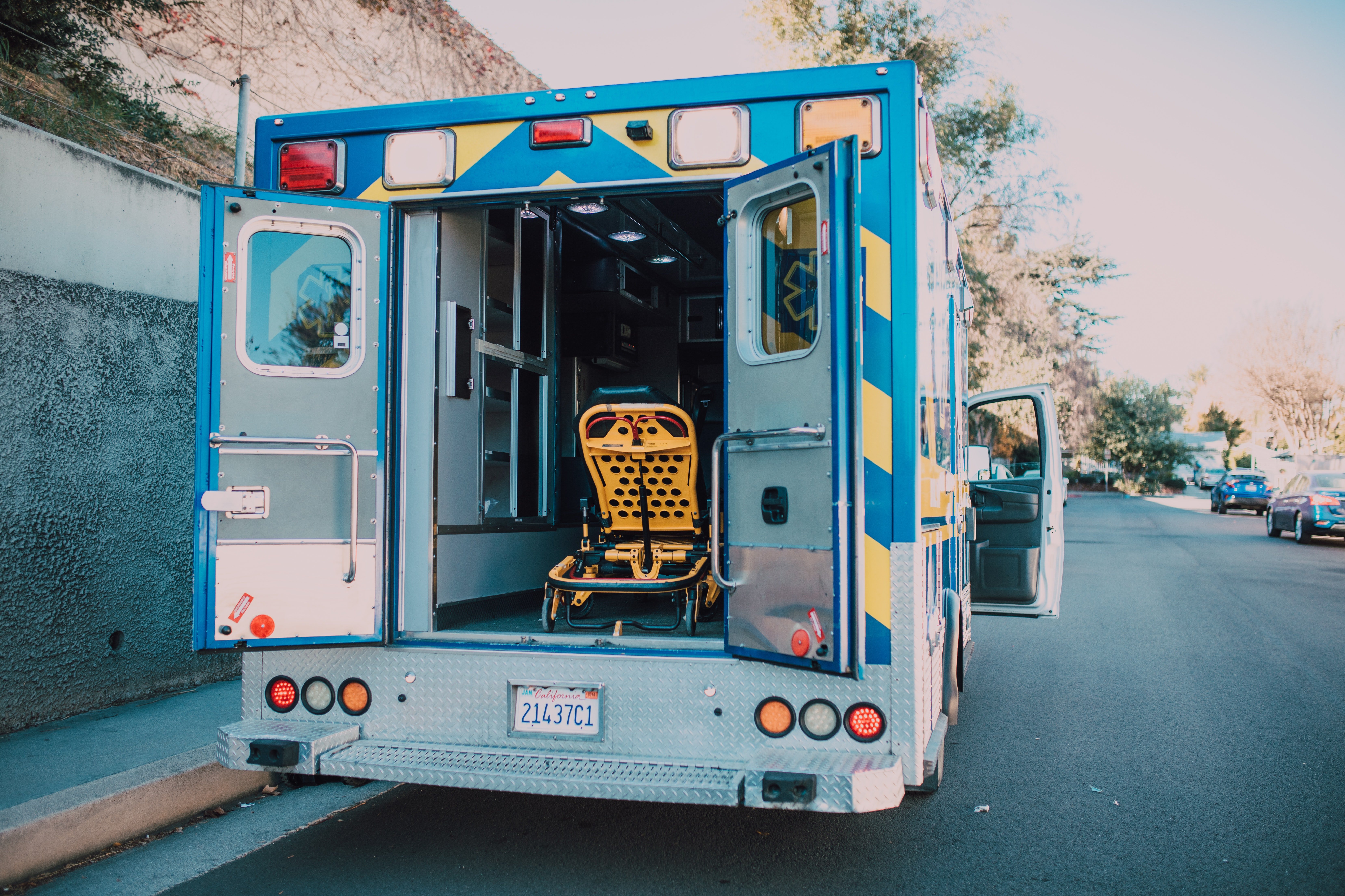 An ambulance with its back doors open. | Pexels