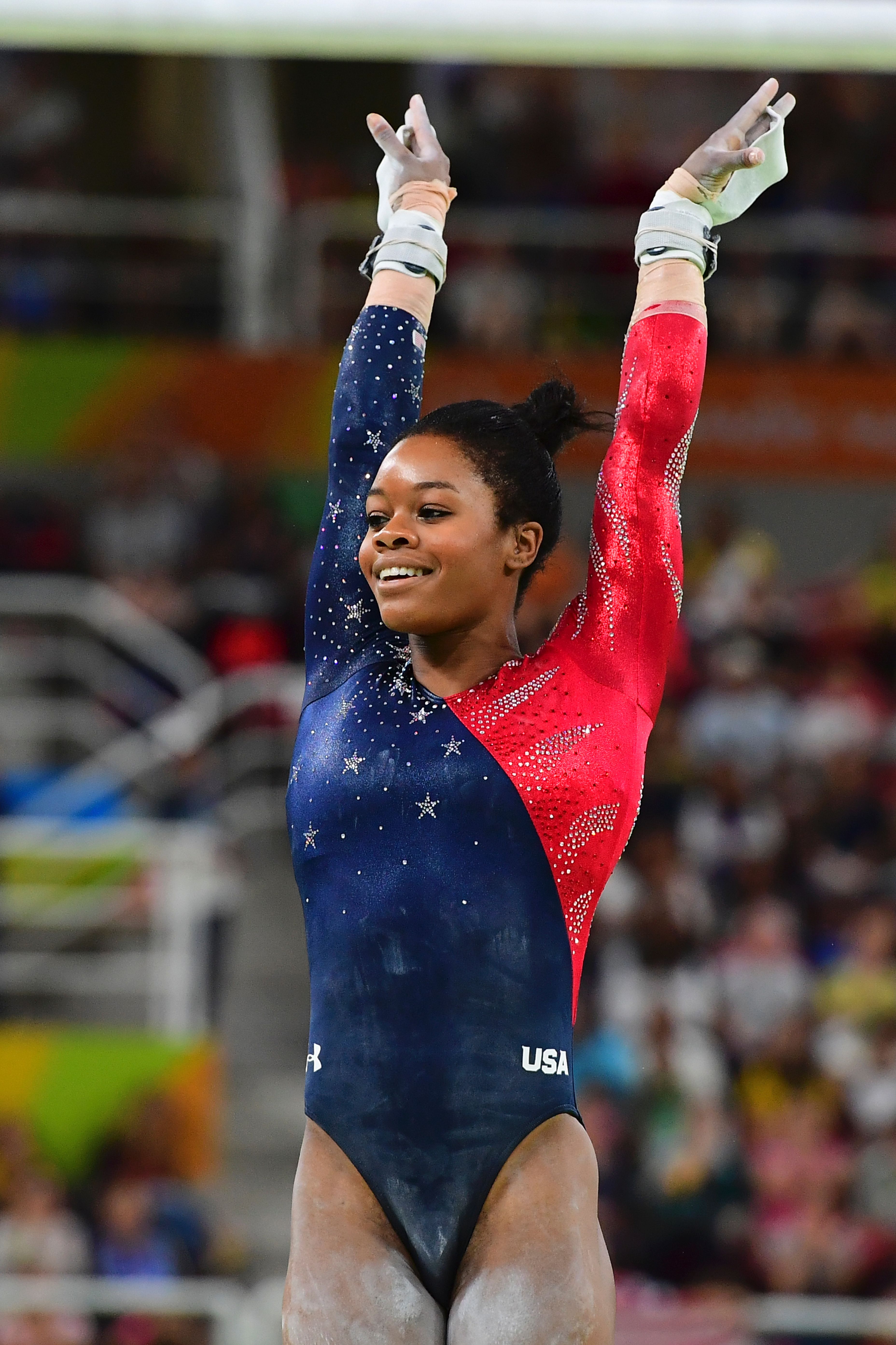 Gabrielle Douglas competes in the qualifying for the women's Uneven Bars event of the Artistic Gymnastics at the Olympic Arena during the Rio 2016 Olympic Games in Rio de Janeiro on August 7, 2016. | Source: Getty Images