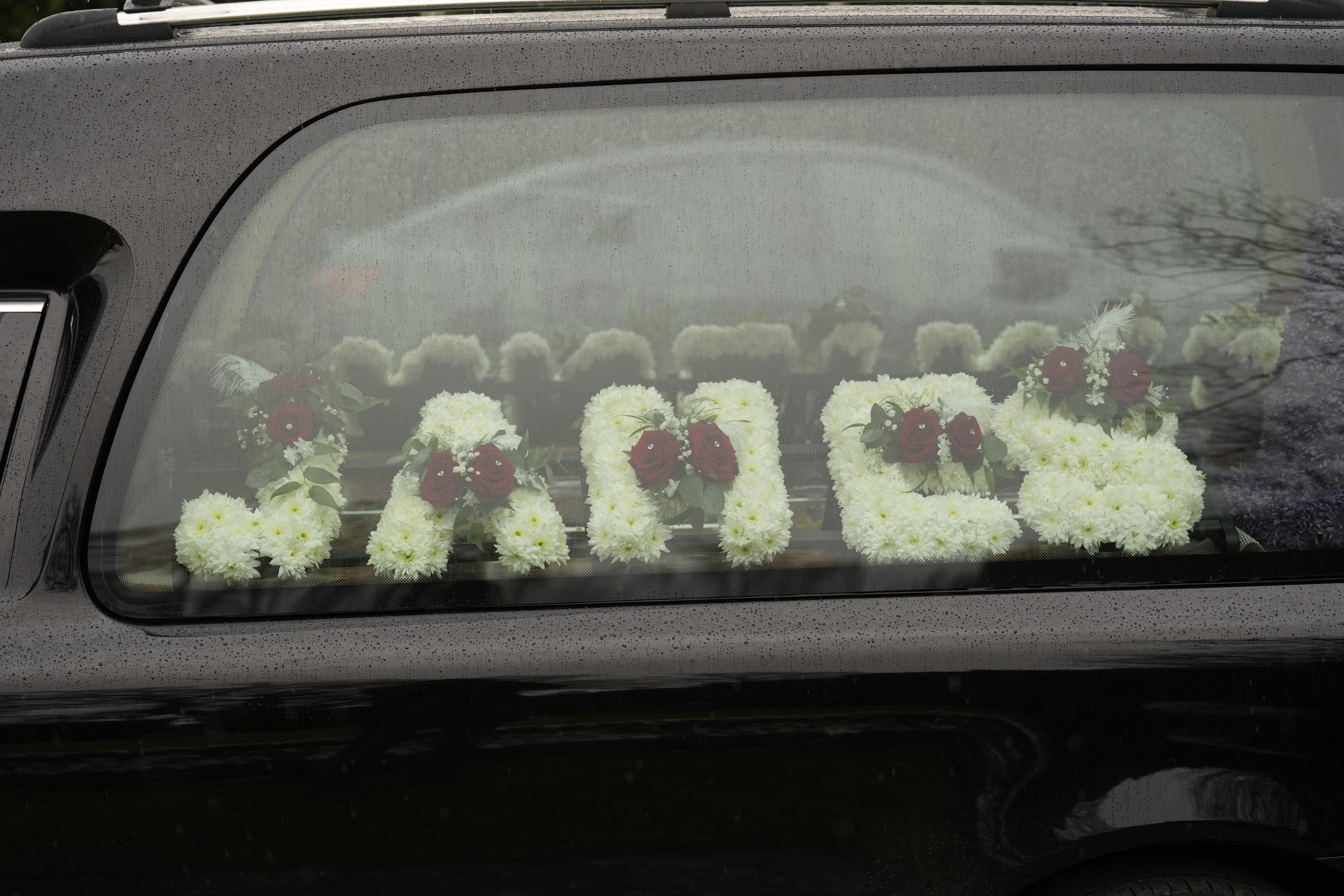 Floral tributes for The Vivienne's funeral at St. Margaret's Church in Bodelwyddan, Denbighshire, on January 27, 2025 | Source: Getty Images