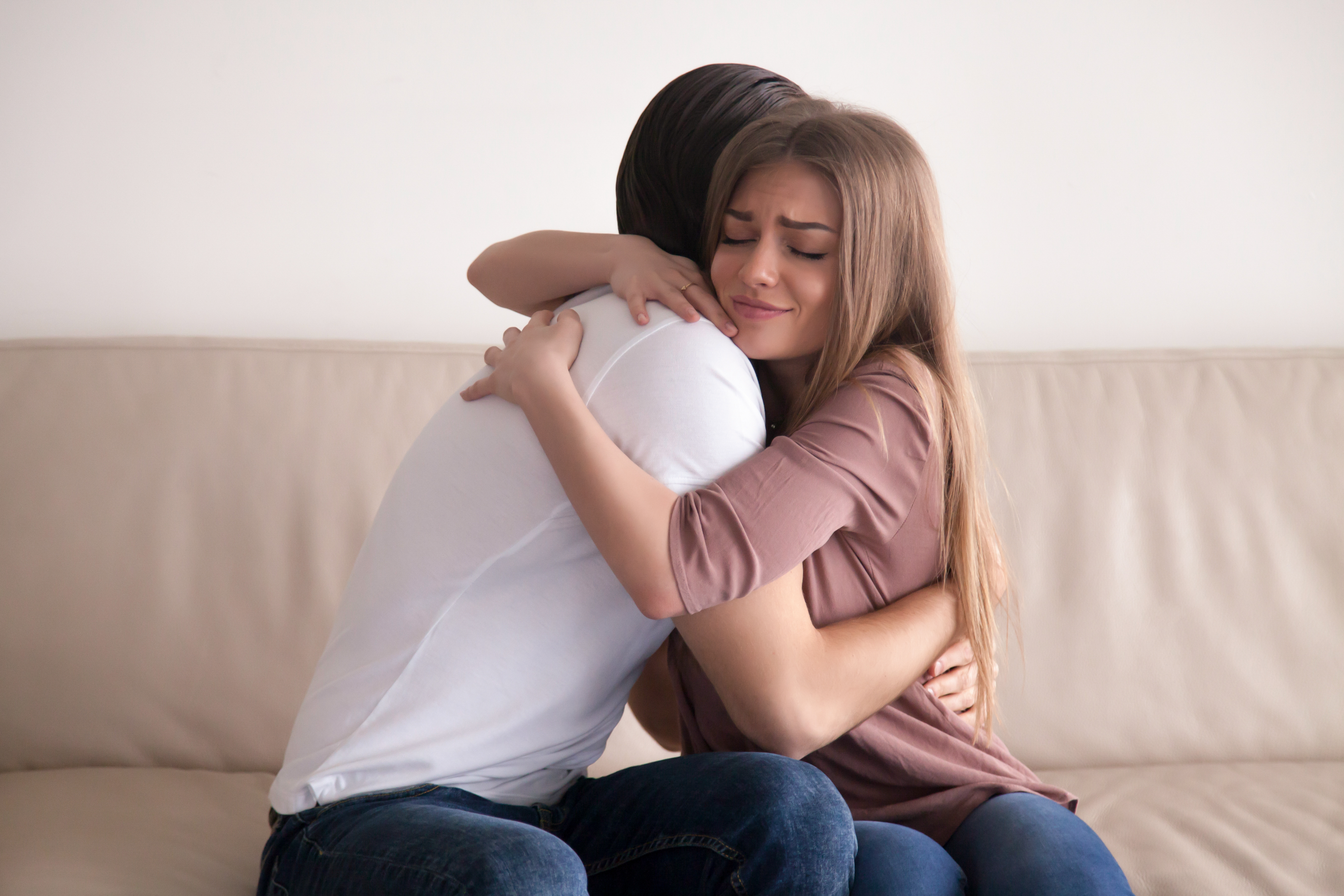 Man hugs his girlfriend | Source: Shutterstock