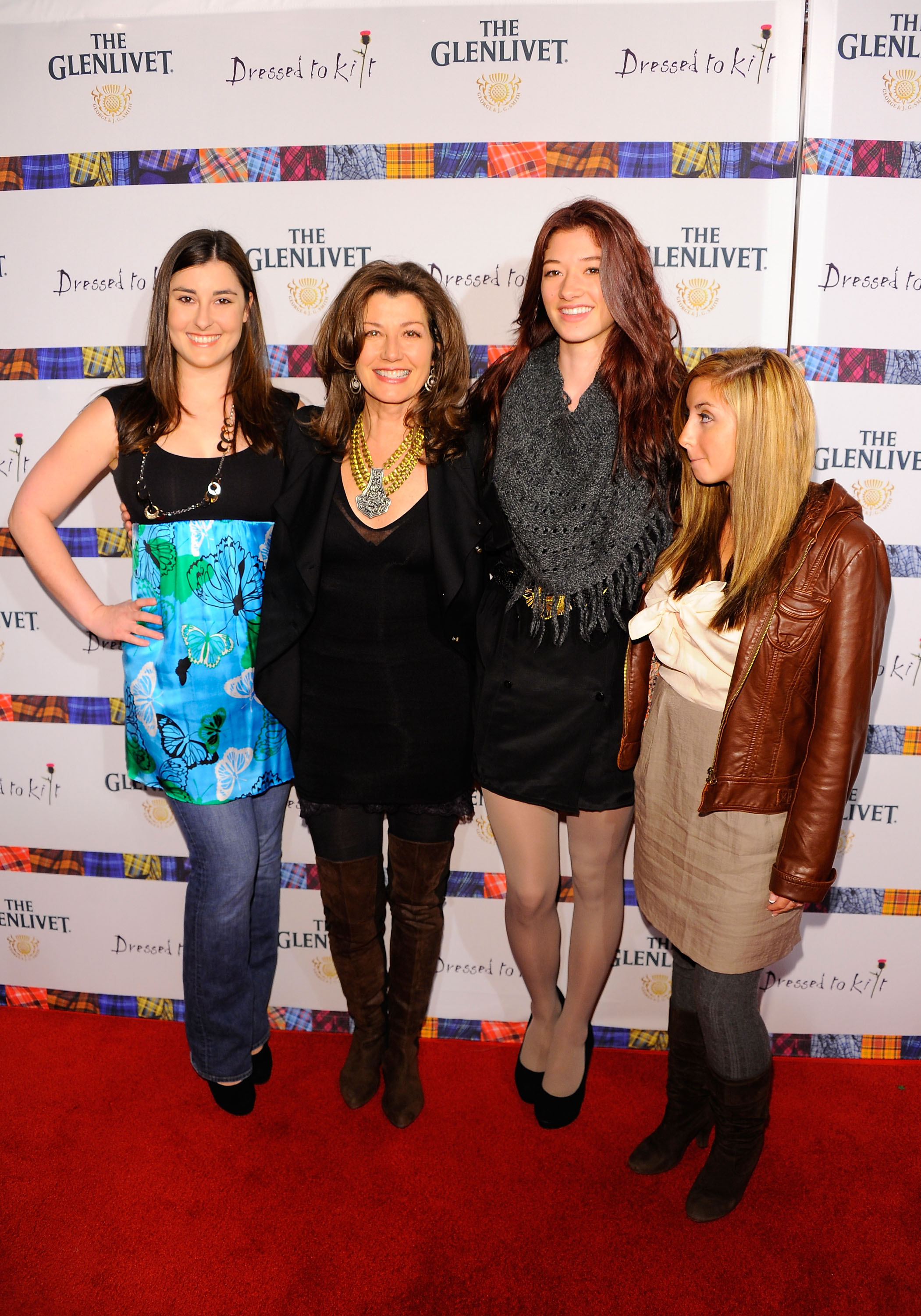 Sarah Chapman, Amy Grant, Millie Chapman, and Jenny Gill at the 9th Annual "Dressed To Kilt" Charity Fashion Show on April 5, 2011, in New York City | Source: Getty Images