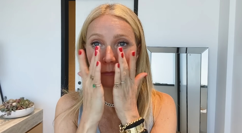 Gwyneth Paltrow applies skincare products during her morning beauty and wellness routine. | Source: YouTube/Vogue