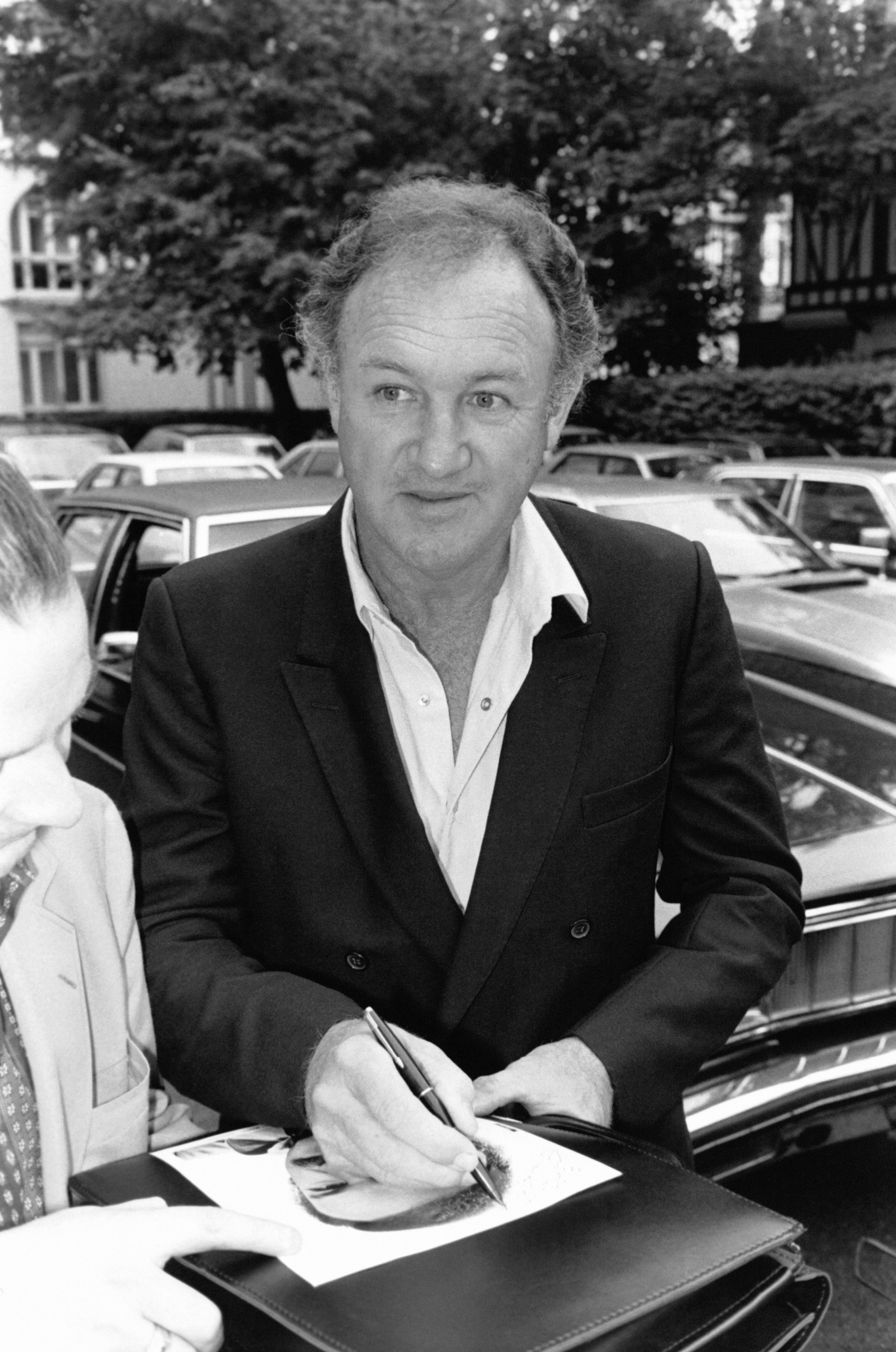 Gene Hackman signs an autograph on October 9, 1981, during a film festival. | Source: Getty Images