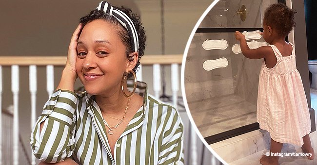 Tia Mowry's Daughter Cairo Sticks Mom's Sanitary Pads on Glass in a ...