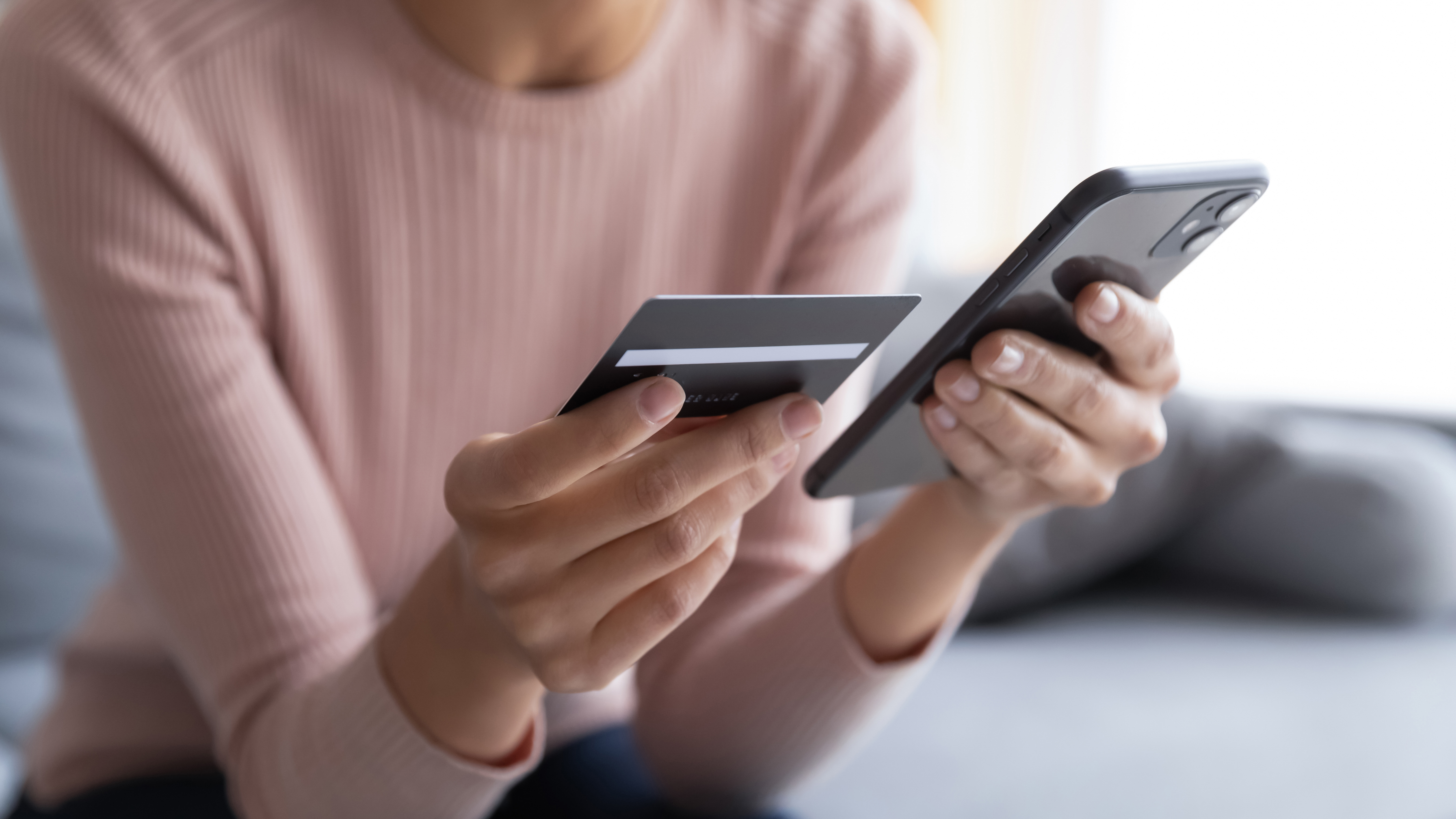 A woman making an online transaction | Source: Shutterstock