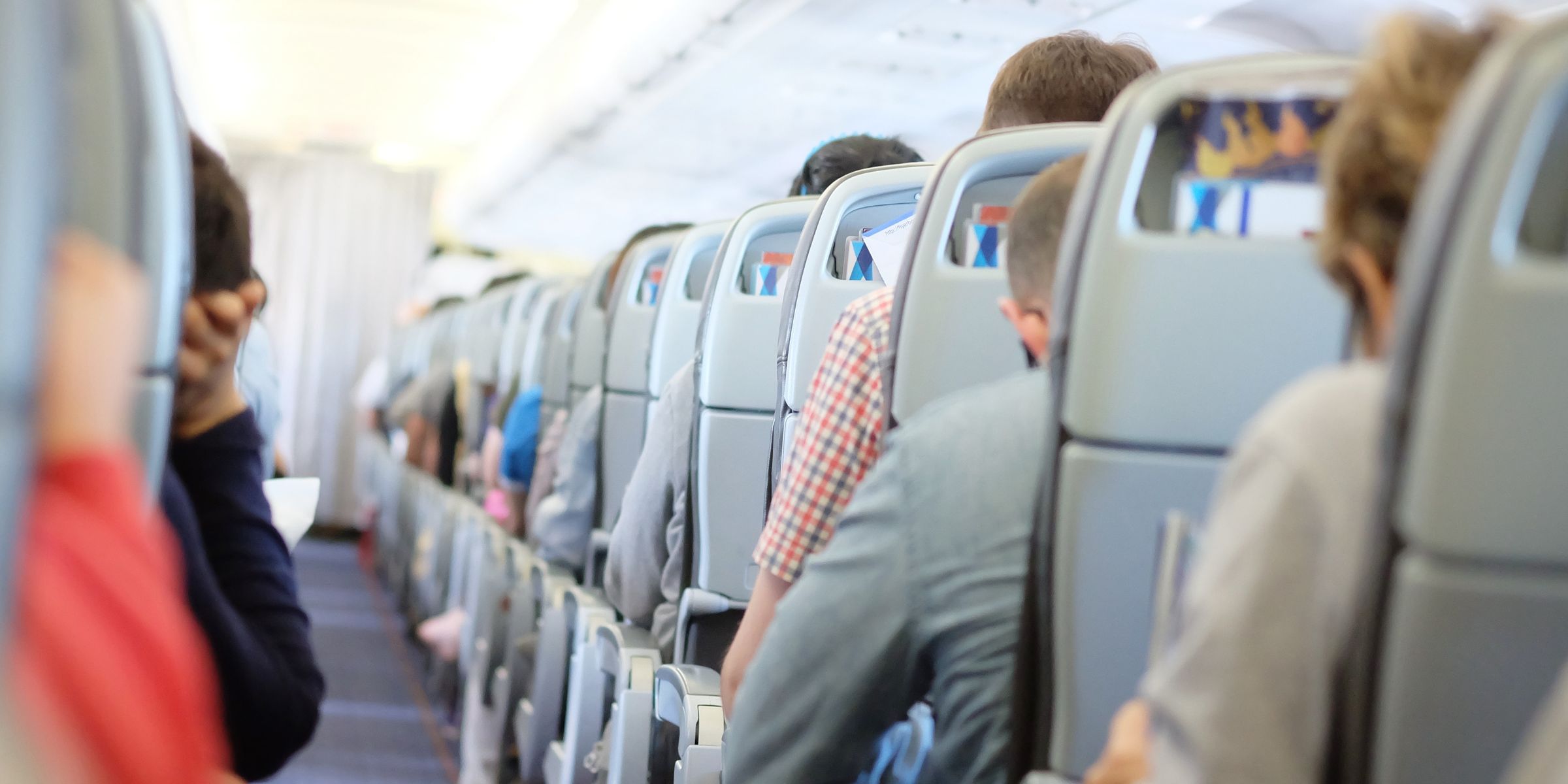 Passengers in a plane | Source: Shutterstock