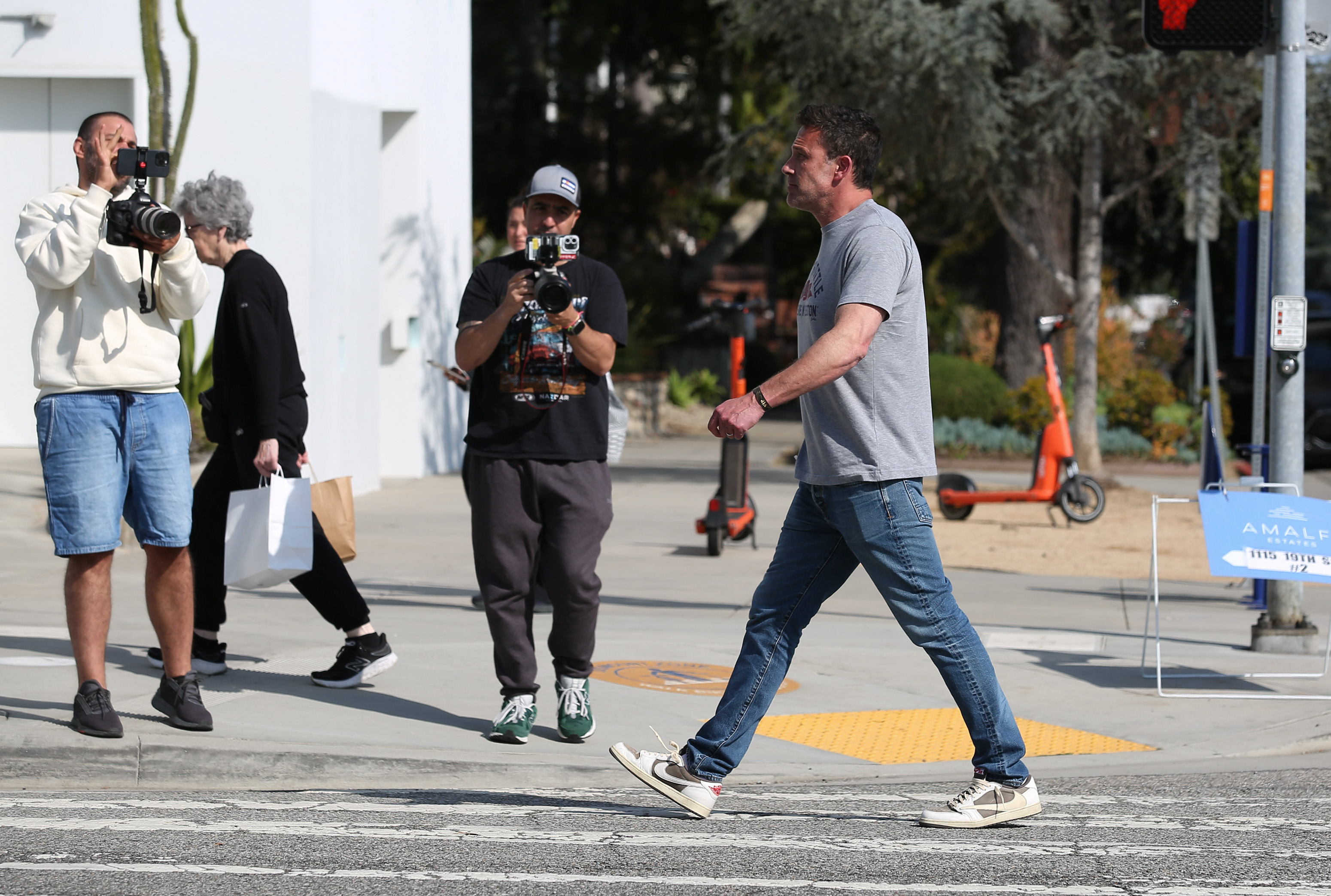 Ben Affleck walks as two men film him in Los Angeles, California on May 19, 2024 | Source: Getty Images