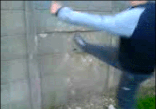 Screenshot of boy's leg stuck in concrete fence. | Source: Reddit