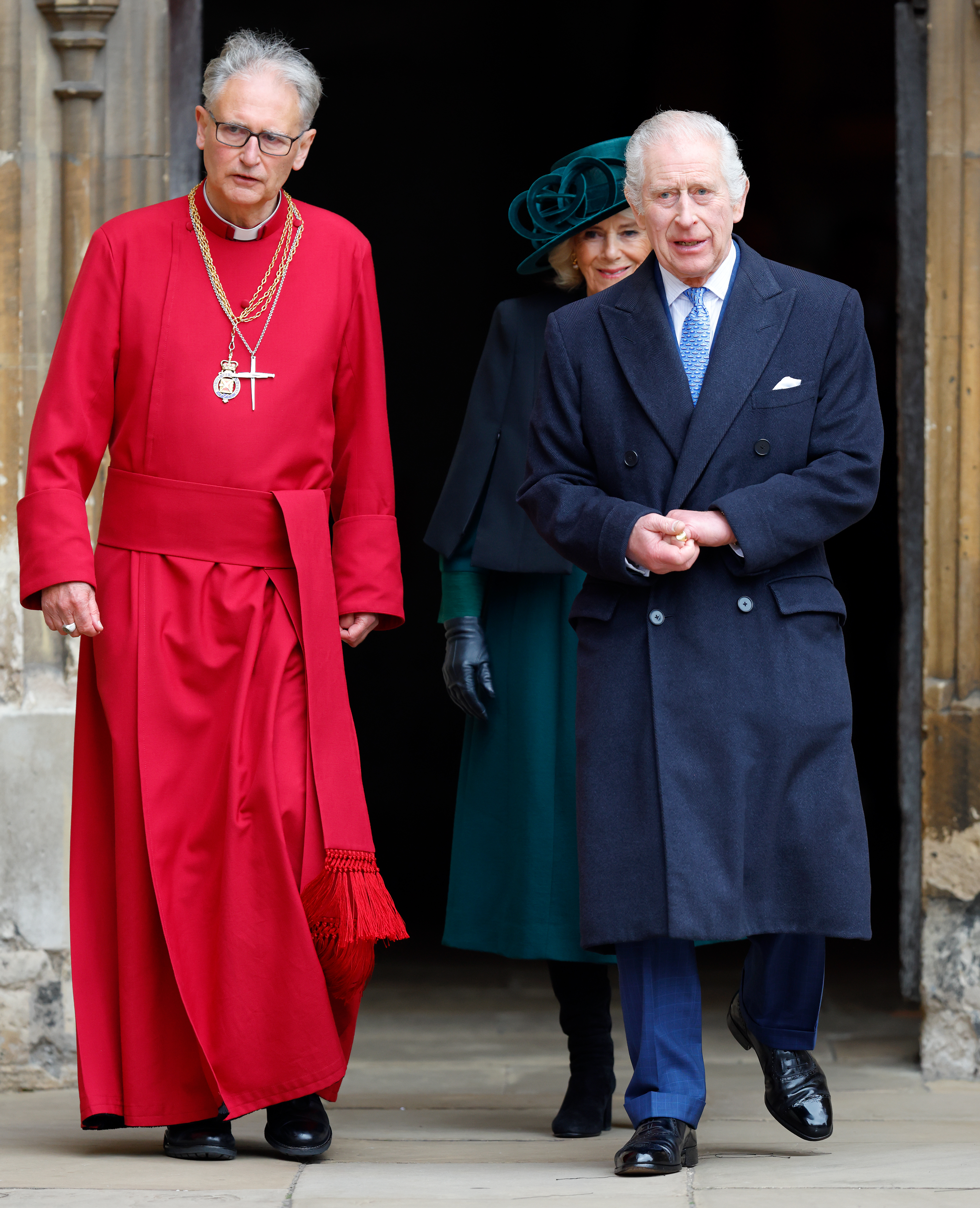 Queen Camilla and King Charles III, accompanied by The Right Reverend Dr. Christopher Cocksworth, Dean of Windsor, attend the traditional Easter Sunday Mattins Service at St. George's Chapel, Windsor Castle on March 31, 2024, in Windsor, England. | Source: Getty Images