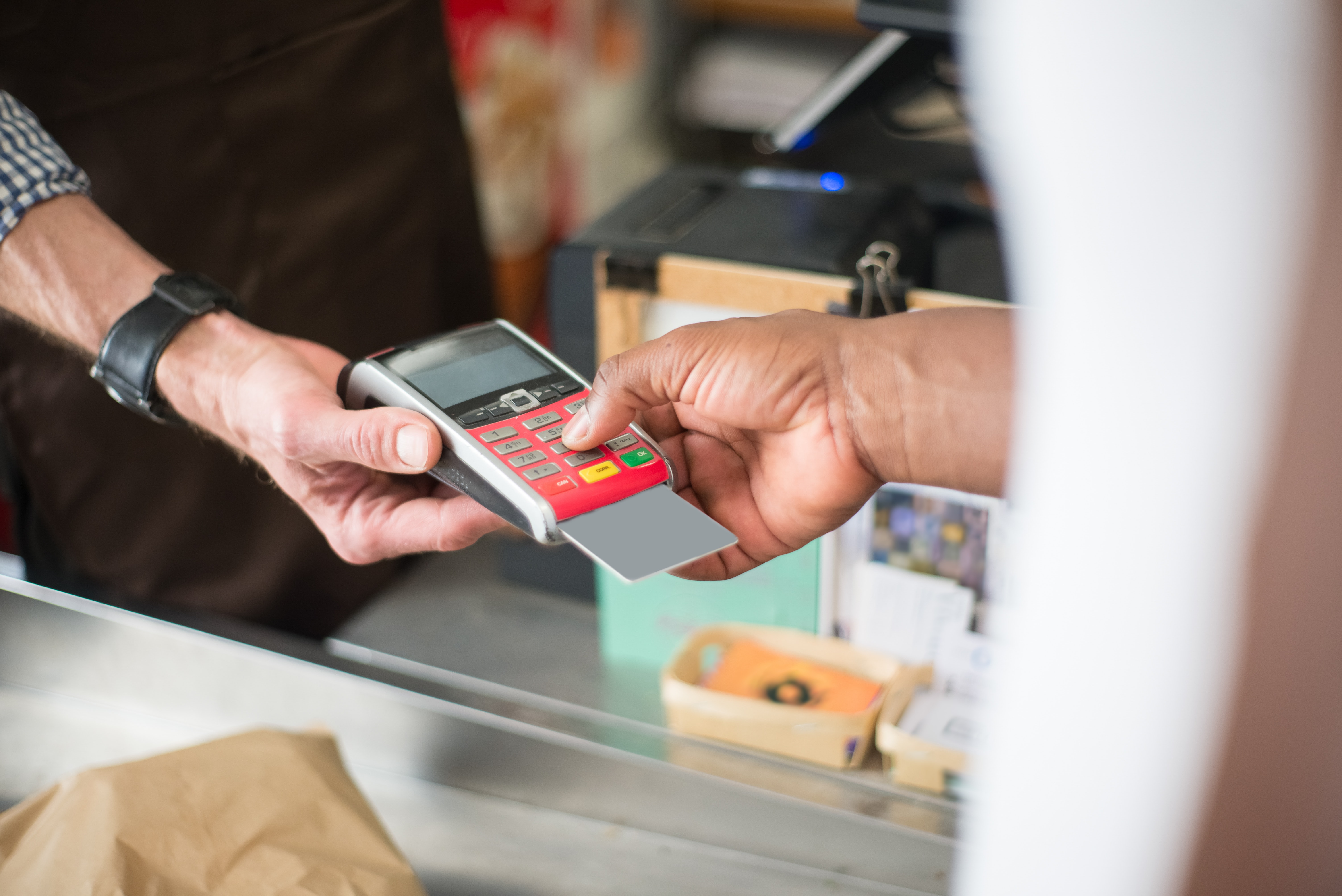 Person paying with card | Source: Pexels