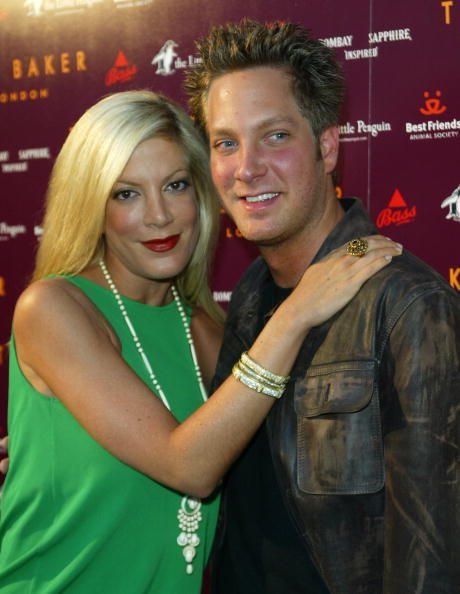 Tori Spelling and Randy Spelling arrive at the Ted Baker Los Angeles store opening on June 16, 2005, in Los Angeles, California. | Source: Getty Images.