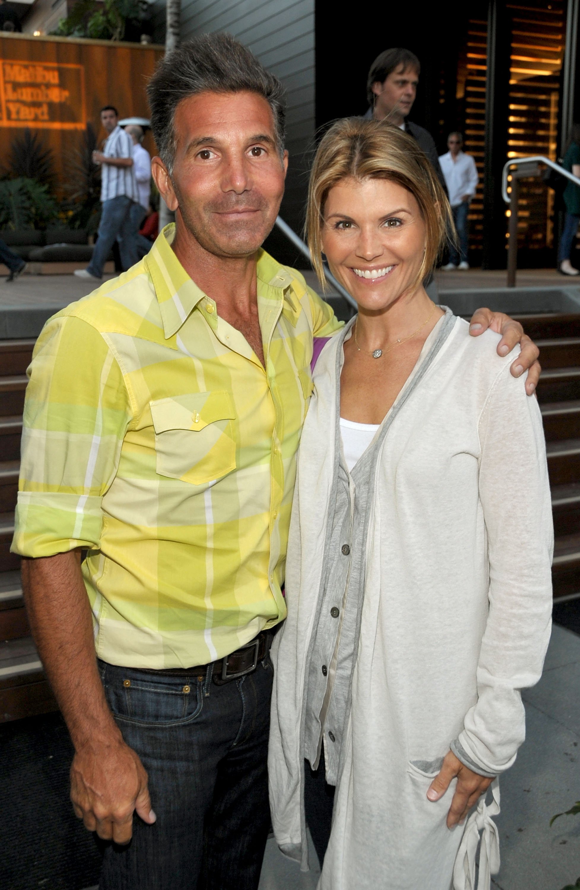 Mossimo Giannulli and actress Lori Loughlin attend the Malibu Lumber Yard grand opening at the Malibu Lumber Yard on April 21, 2009 in Malibu, California | Photo: Getty Images