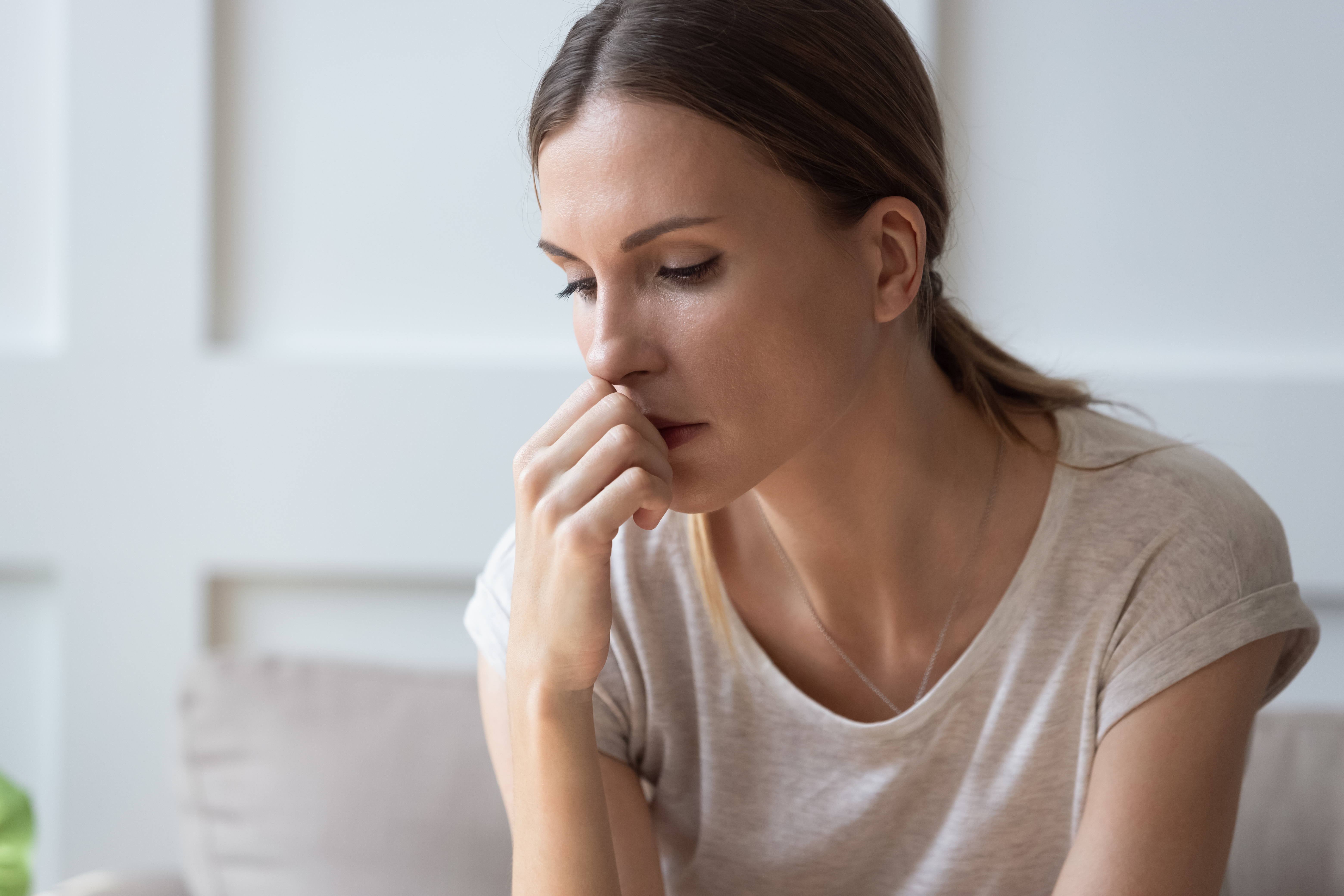 Close up of sad pensive millennial woman | Source: Shutterstock