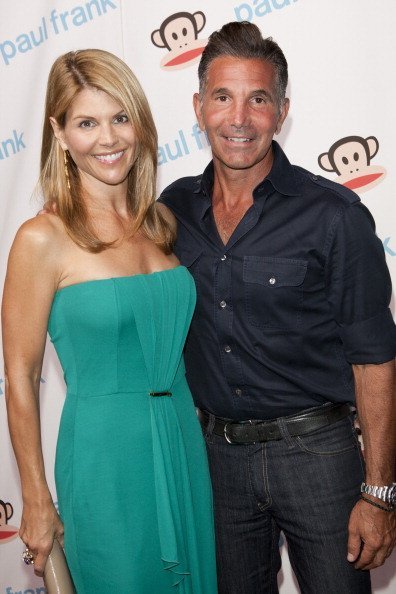 Lori Loughlin and Massimo attend Paul Frank's Fashion's Night Out at ADBD Gallery on September 8, 2011, in Los Angeles, California.| Source: Getty Images