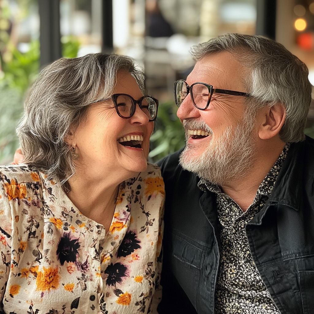 An elderly couple laughing | Source: Midjourney